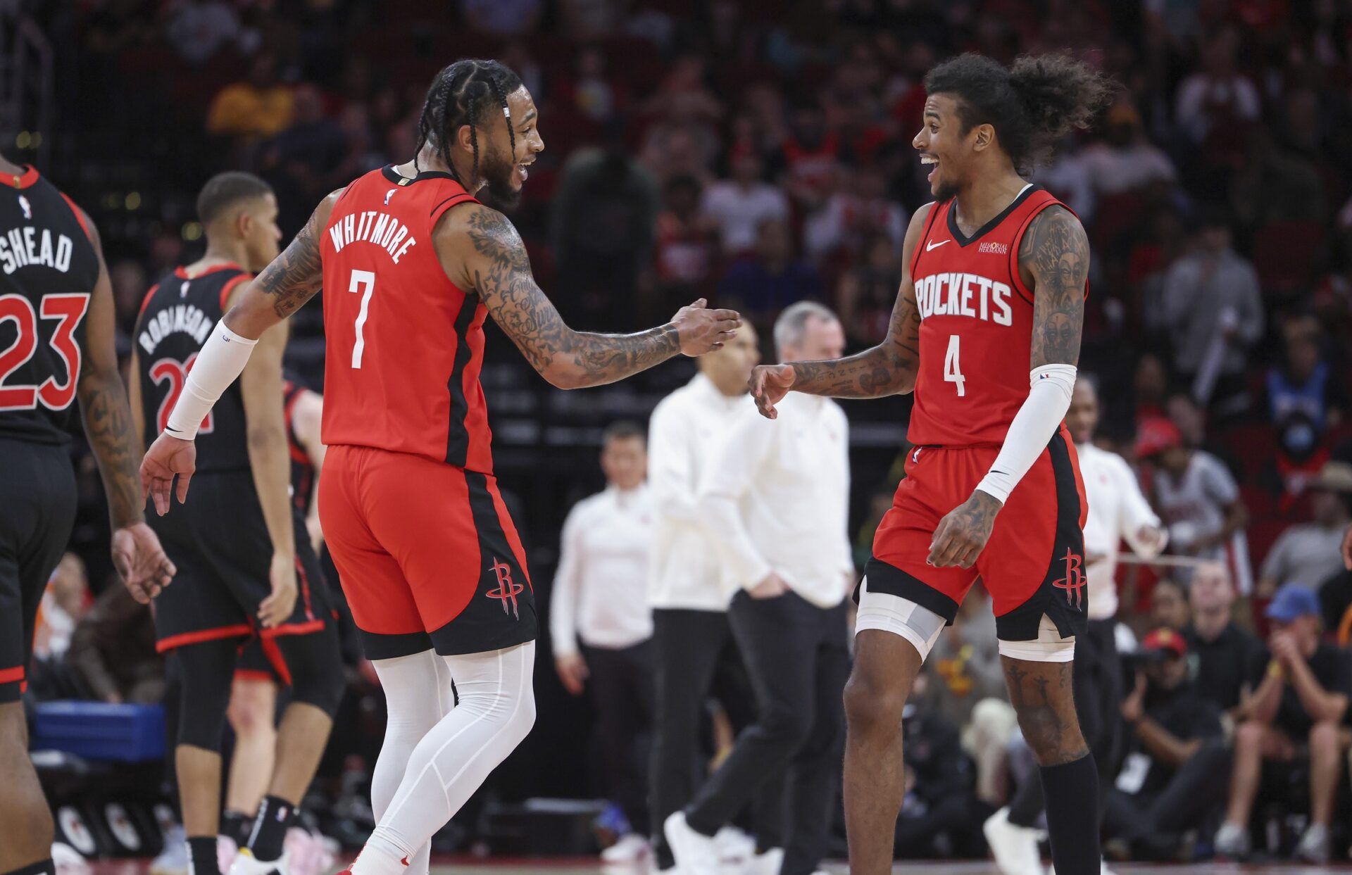 Houston Rockets forward Cam Whitmore (7) and guard Jalen Green (4) celebrate after a play during the fourth quarter against the Toronto Raptors at Toyota Center.