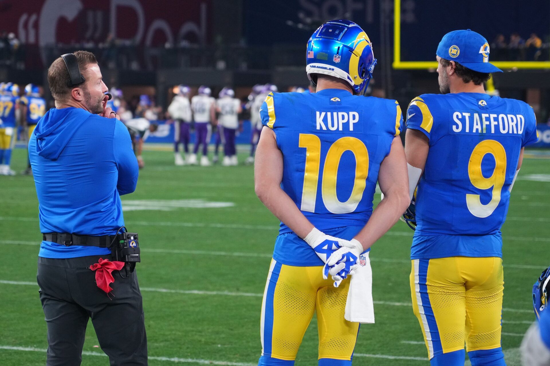 Los Angeles Rams head coach Sean McVay, quarterback Matthew Stafford (9) and wide receiver Cooper Kupp (10) watch from the sidelines against the Minnesota Vikings during the second half in an NFC wild card game at State Farm Stadium.