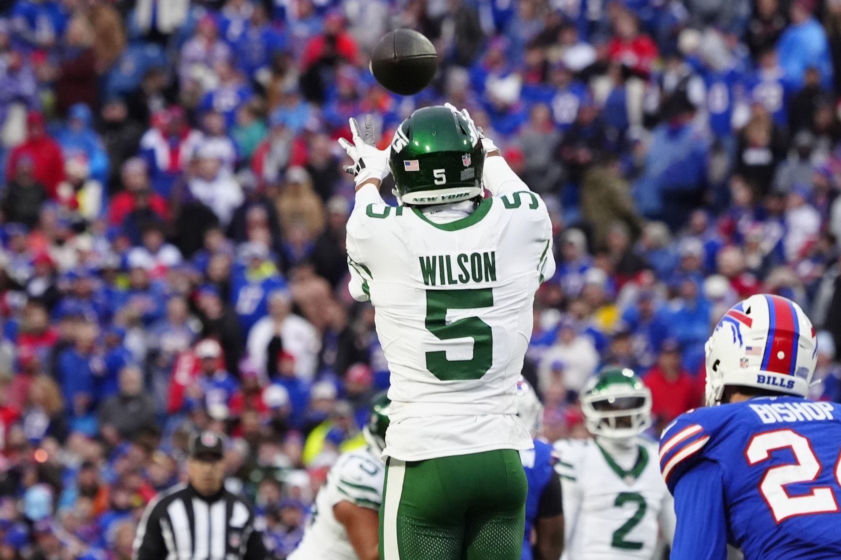 New York Jets wide receiver Garrett Wilson (5) makes a catch against the Buffalo Bills during the second half at Highmark Stadium.