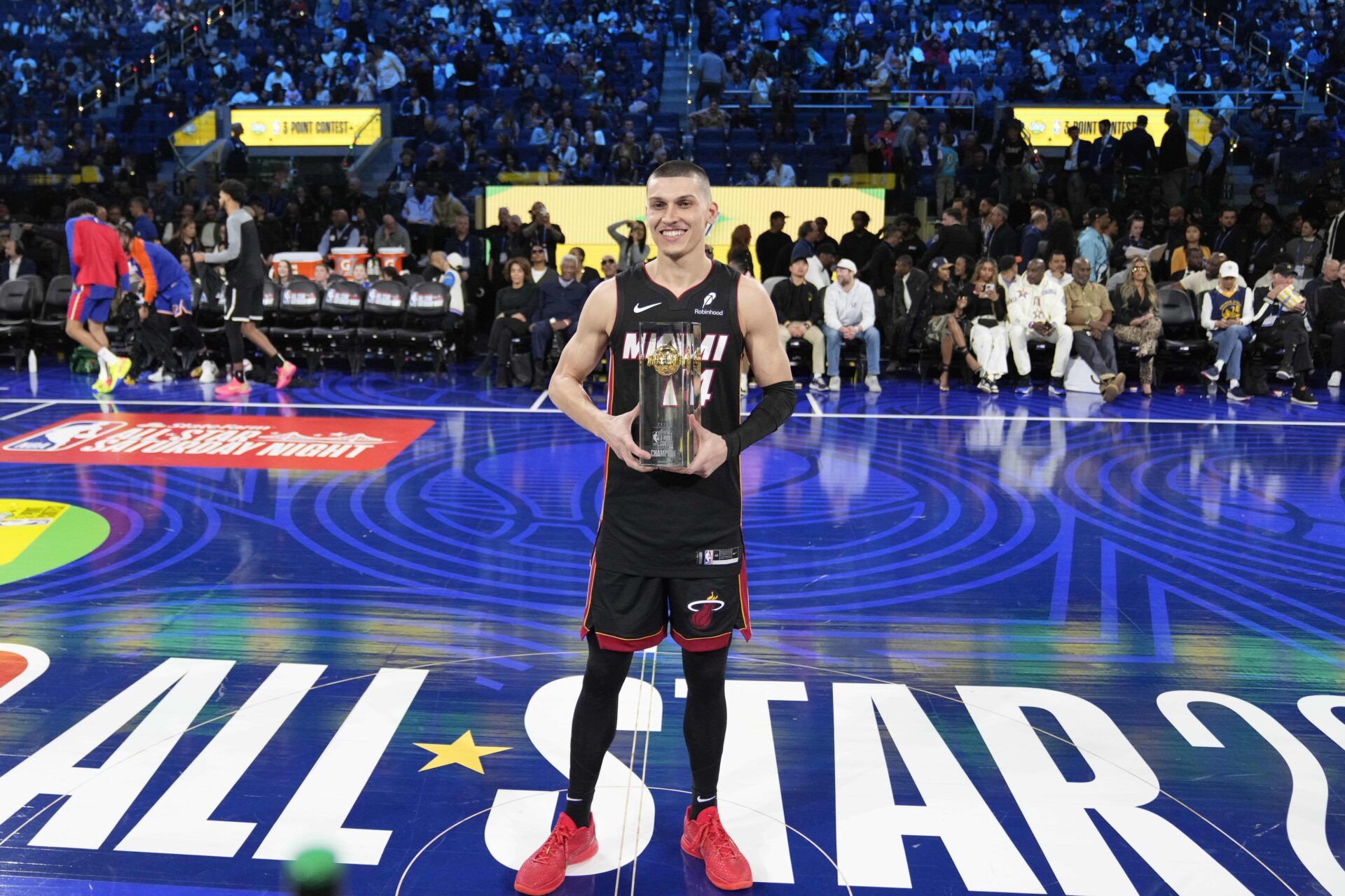 Miami Heat guard Tyler Herro (14) celebrates with the trophy after winning the three-point contest during All Star Saturday Night ahead of the 2025 NBA All Star Game at Chase Center.