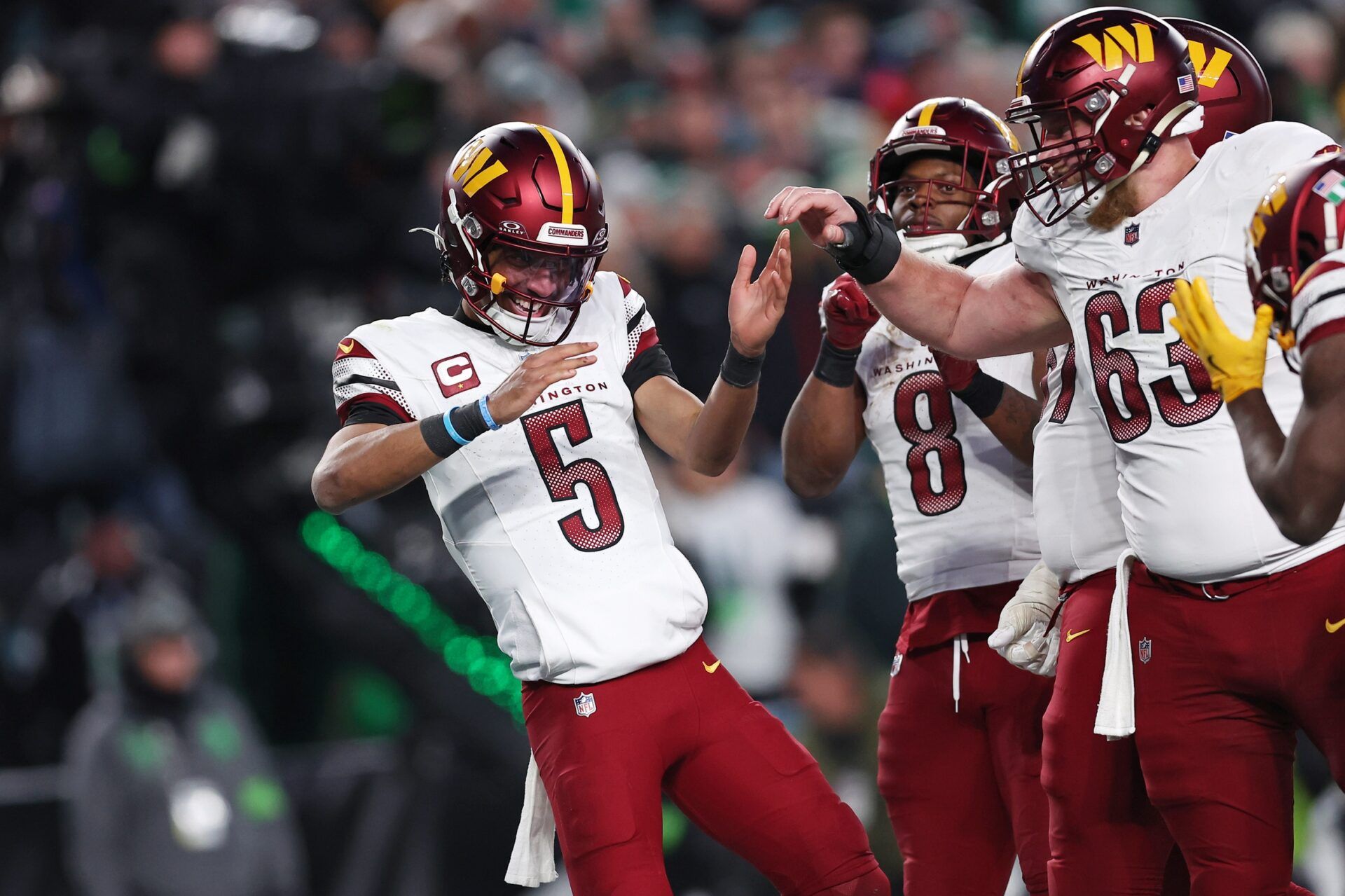 Washington Commanders quarterback Jayden Daniels (5) celebrates after a play against the Philadelphia Eagles during the second half in the NFC Championship game at Lincoln Financial Field.