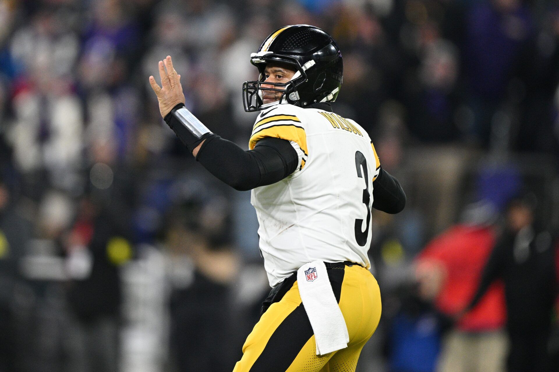 Pittsburgh Steelers quarterback Russell Wilson (3) looks to pass in the first quarter against the Baltimore Ravens in an AFC wild card game at M&T Bank Stadium.