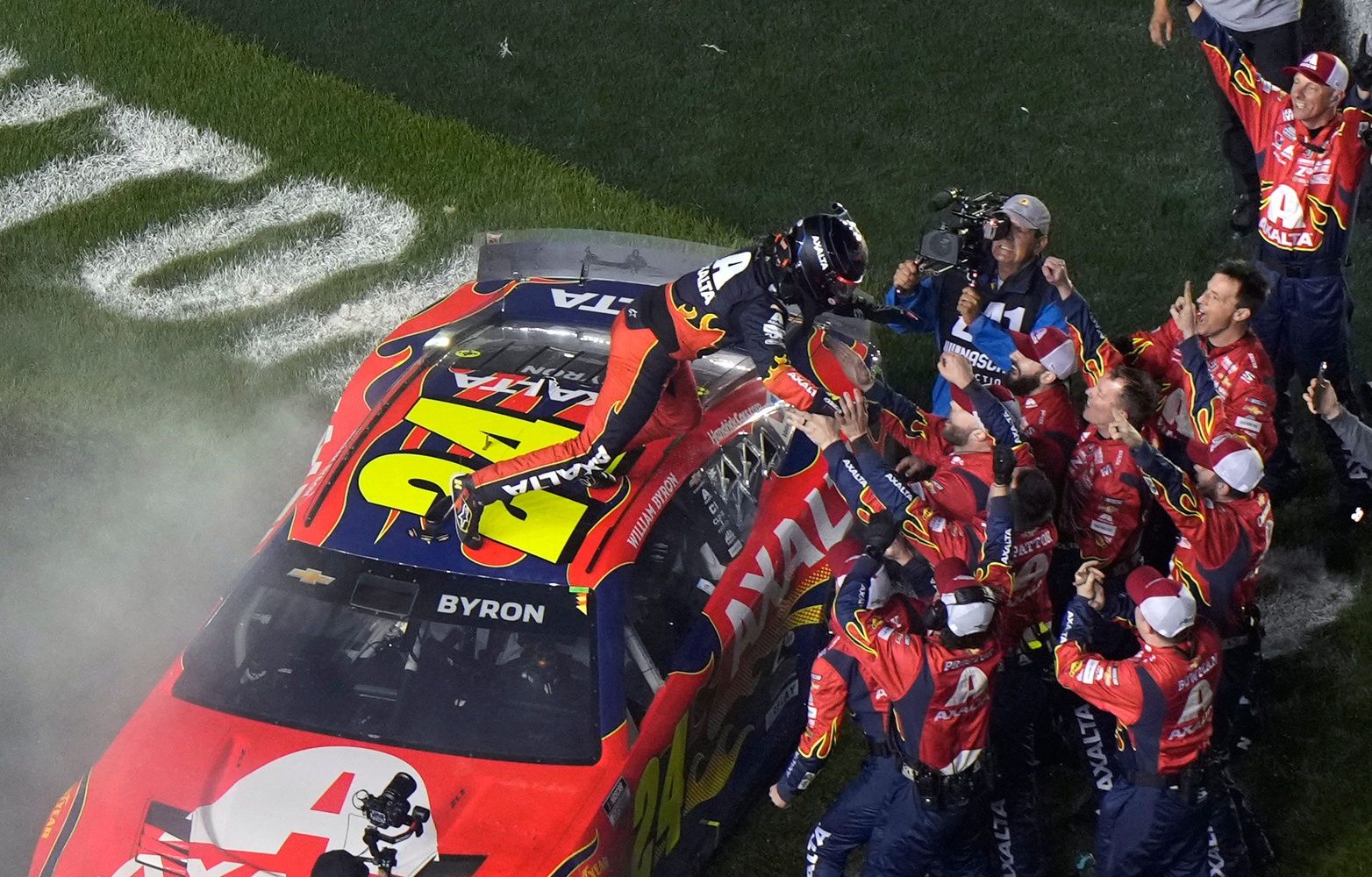 William Byron jumps into the arms of his crew after winning the Daytona 500 at Daytona International Speedway, Sunday, Feb. 16, 2025.