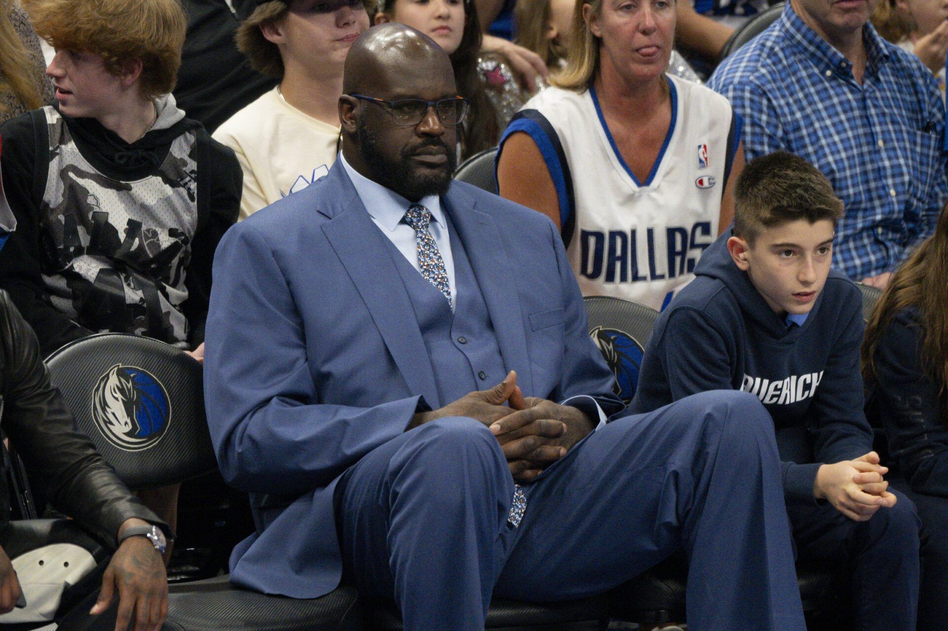 Shaquille O'Neal watches the game between the Dallas Mavericks and the Minnesota Timberwolves in game four of the western conference finals for the 2024 NBA playoffs at American Airlines Center.