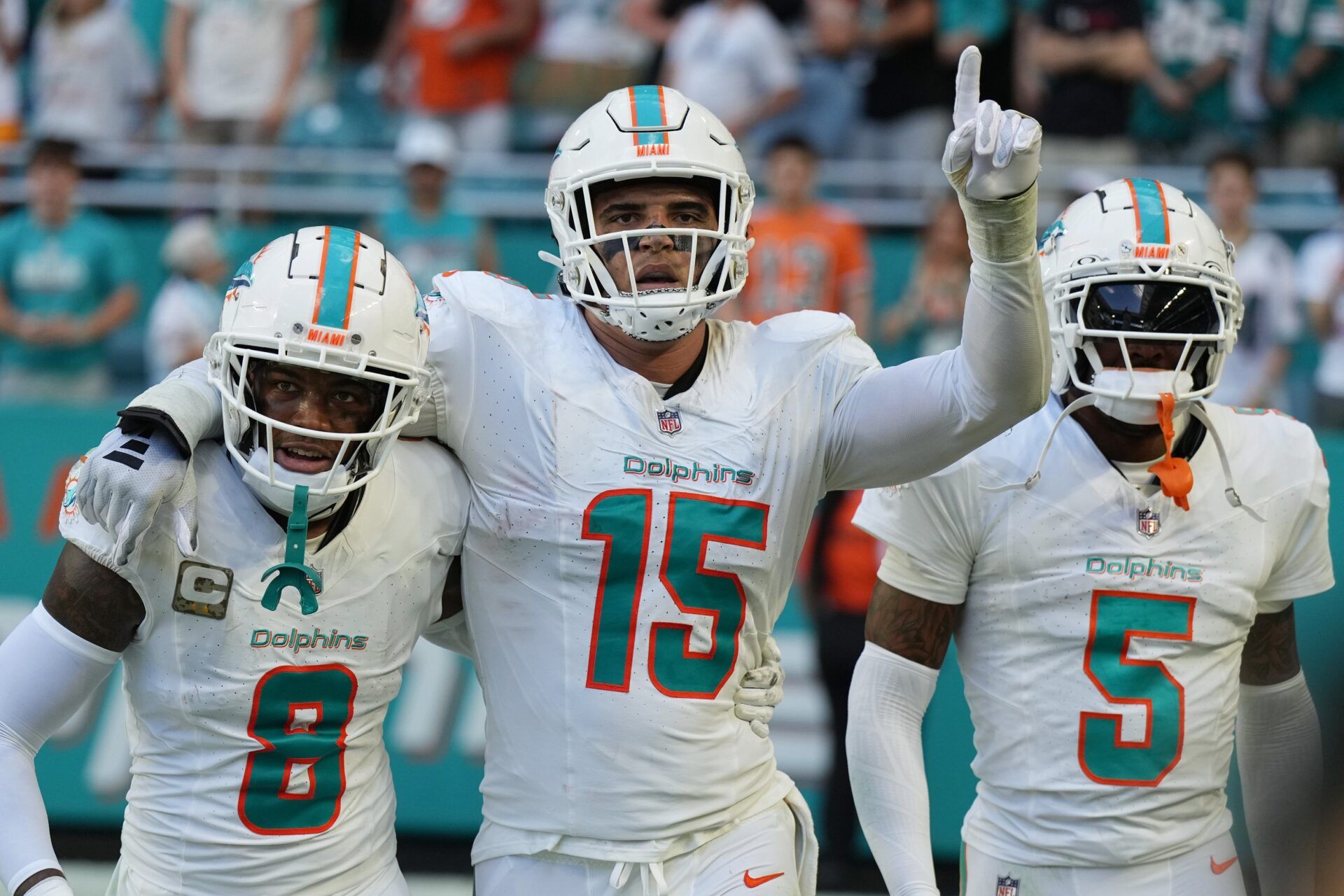 Miami Dolphins linebacker Jaelan Phillips (15) celebrates an interception during the second half of an NFL game against the Las Vegas Raiders with teammates safety Jevon Holland (8) and cornerback Jalen Ramsey (5) at Hard Rock Stadium in Miami Gardens, Nov. 19, 2023.