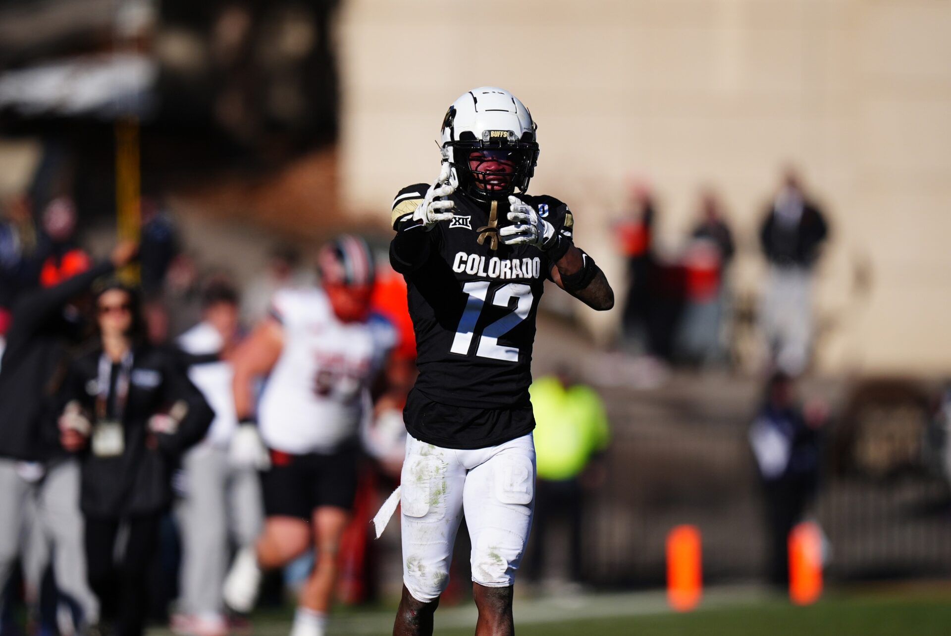 Colorado Buffaloes wide receiver Travis Hunter (12) celebrates his first down reception in the fourth quarter against the Oklahoma State Cowboys at Folsom Field.