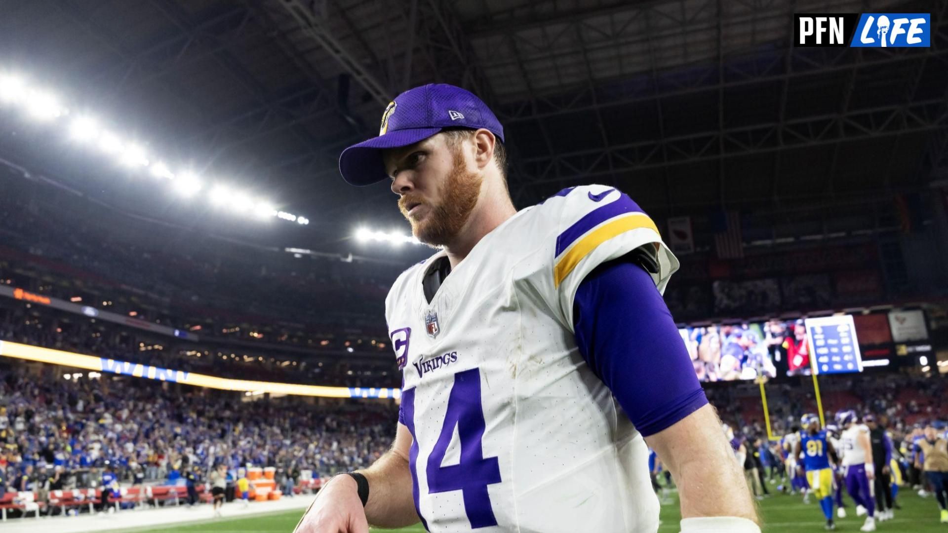 Minnesota Vikings quarterback Sam Darnold (14) reacts as he walks off the field after losing to the Los Angeles Rams during an NFC wild card game at State Farm Stadium.