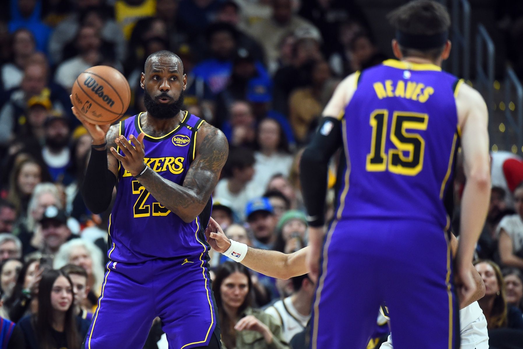 Los Angeles Lakers forward LeBron James (23) passes the ball during the first half against the Denver Nuggets at Ball Arena.