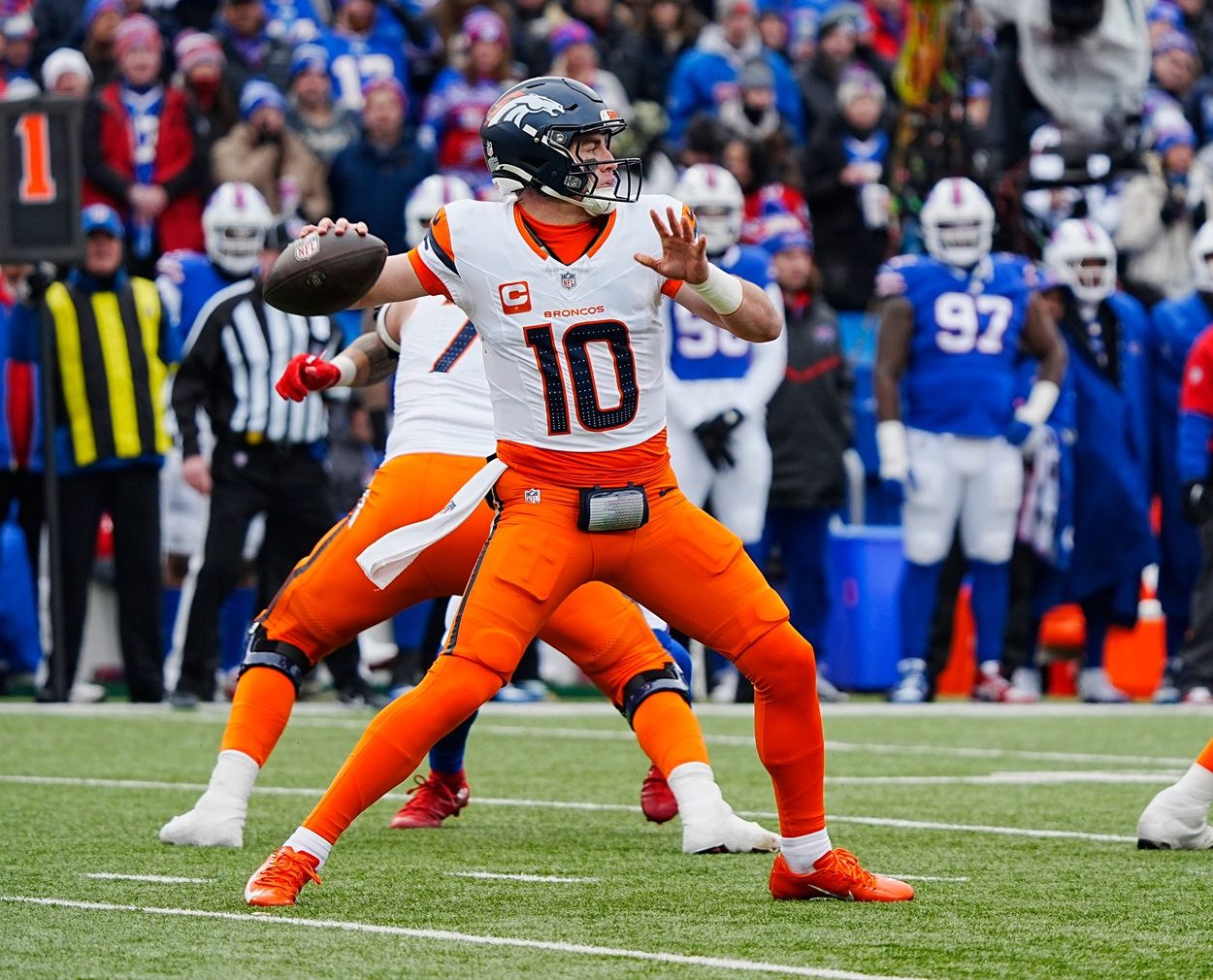 Denver Broncos quarterback Bo Nix (10) throws a. Pass during the first half of the Buffalo Bills wild card game against the Denver Broncos at Highmark Stadium in Orchard Park on Jan. 12, 2025.