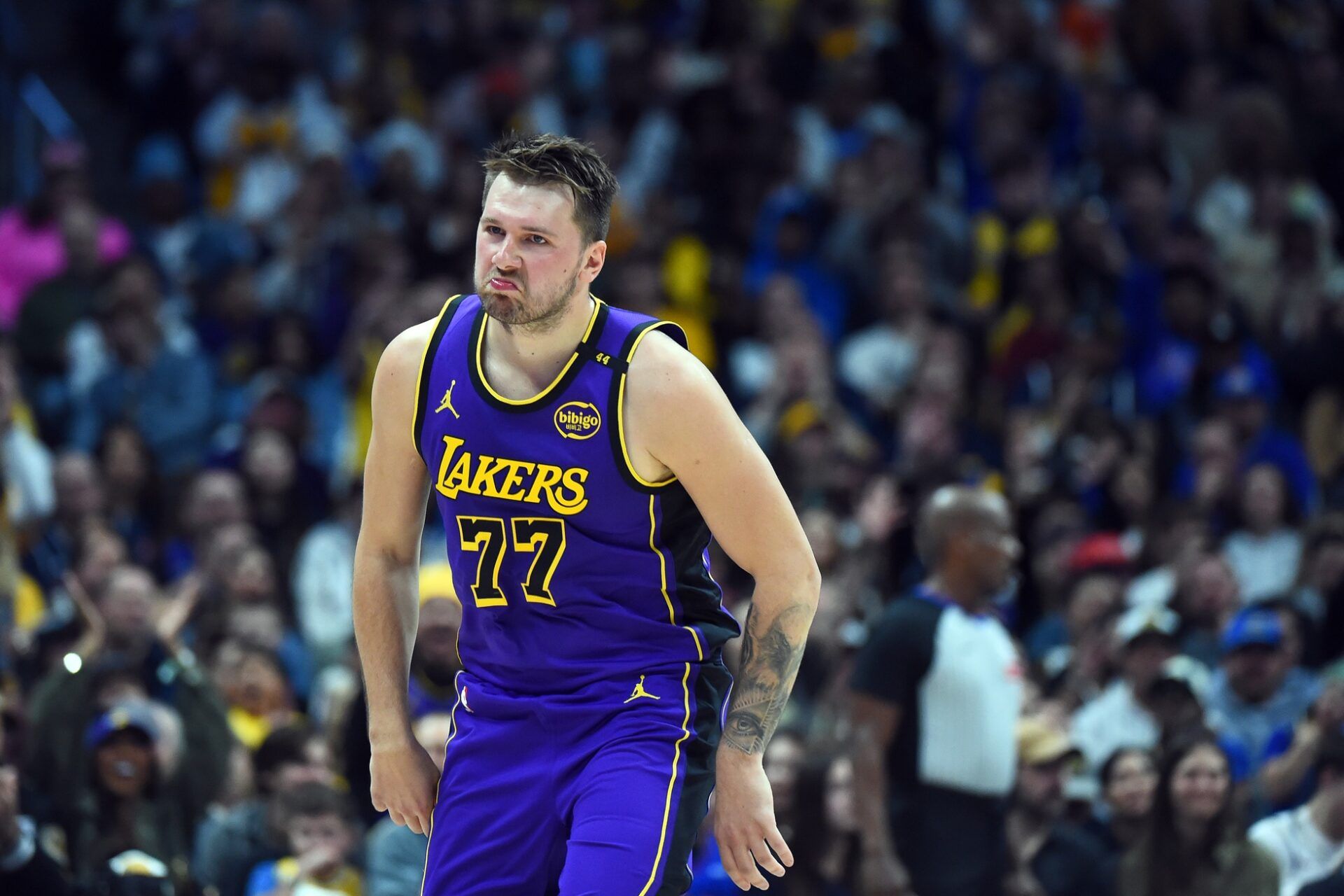 Los Angeles Lakers guard Luka Doncic (77) celebrates after a basket during the first half against the Denver Nuggets at Ball Arena.