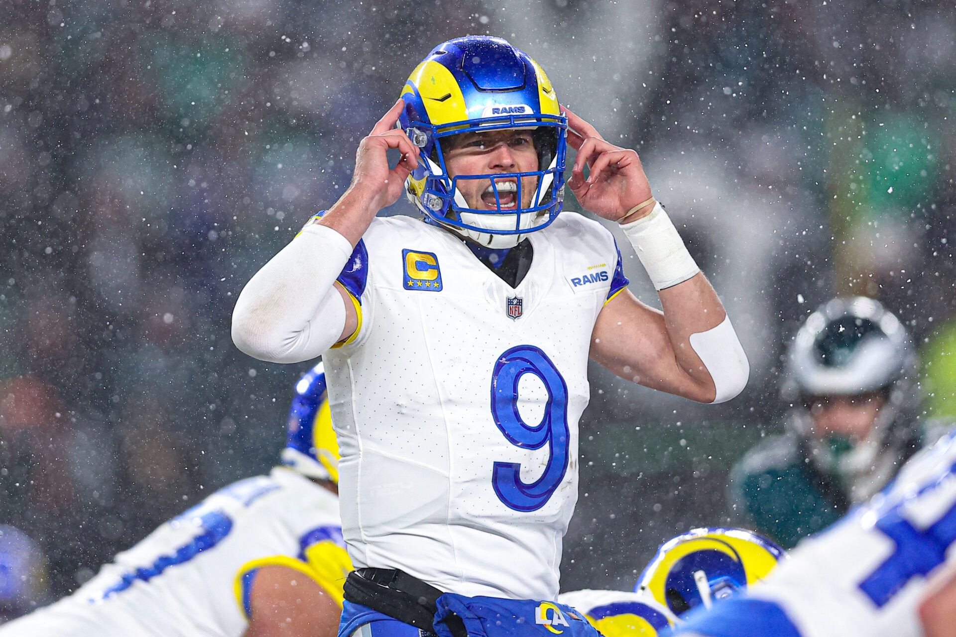 Jan 19, 2025; Philadelphia, Pennsylvania, USA; Los Angeles Rams quarterback Matthew Stafford (9) calls a play at the one of scrimmage against the Philadelphia Eagles in a 2025 NFC divisional round game at Lincoln Financial Field. Mandatory Credit: Bill Streicher-Imagn Images