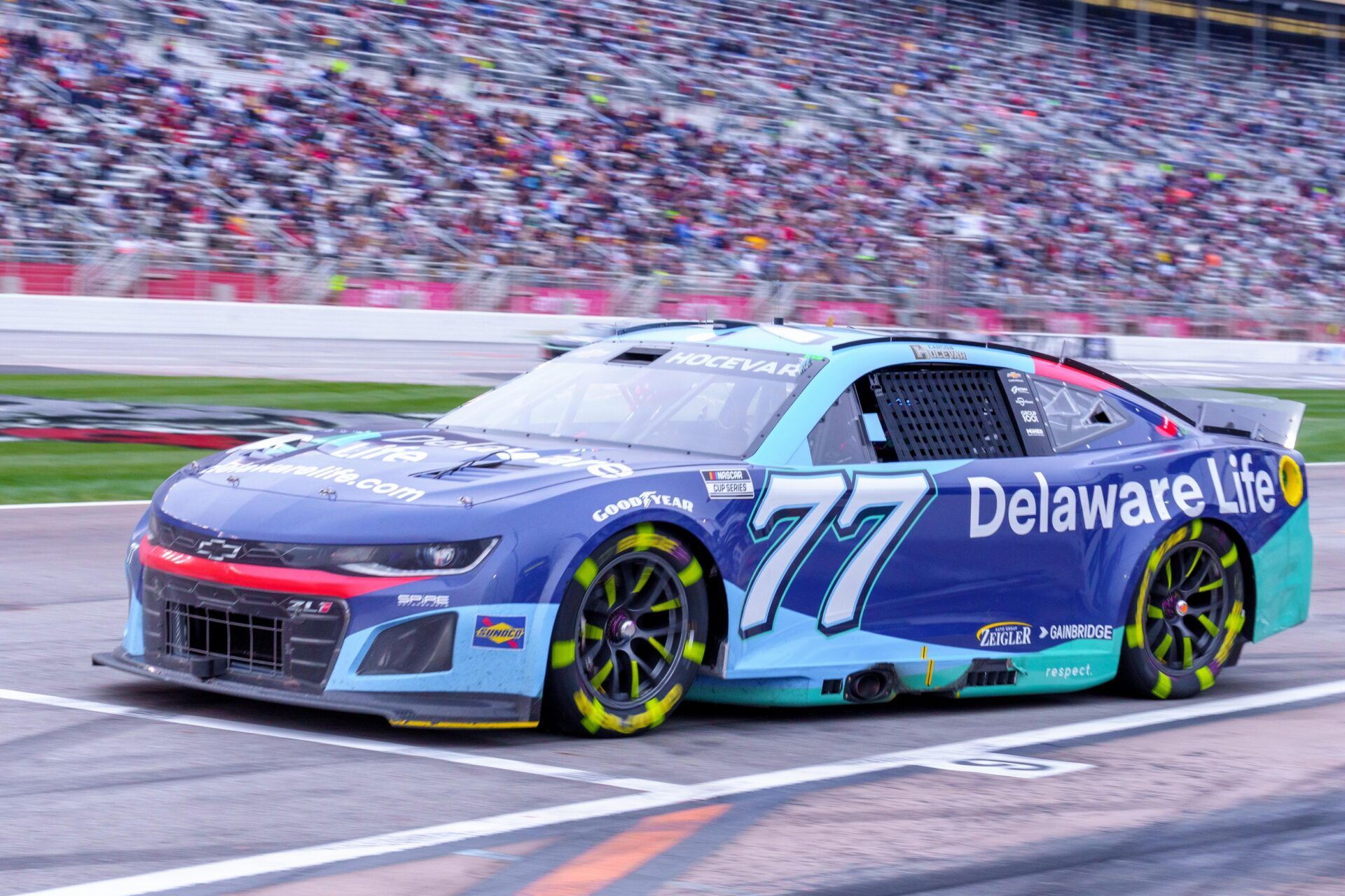 Carson Hocevar (77) comes out of pit row at Atlanta Motor Speedway.