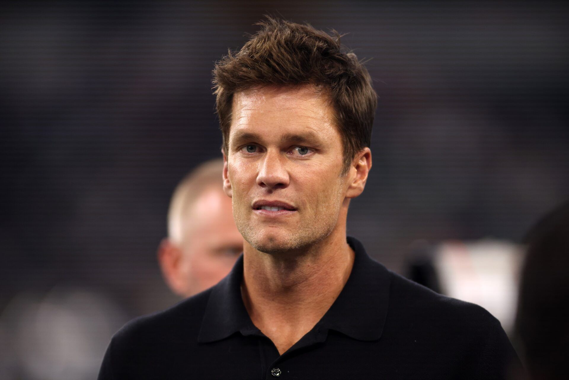 Former NFL player Tom Brady on the field before the game between the Dallas Cowboys and the Las Vegas Raiders at AT&T Stadium.