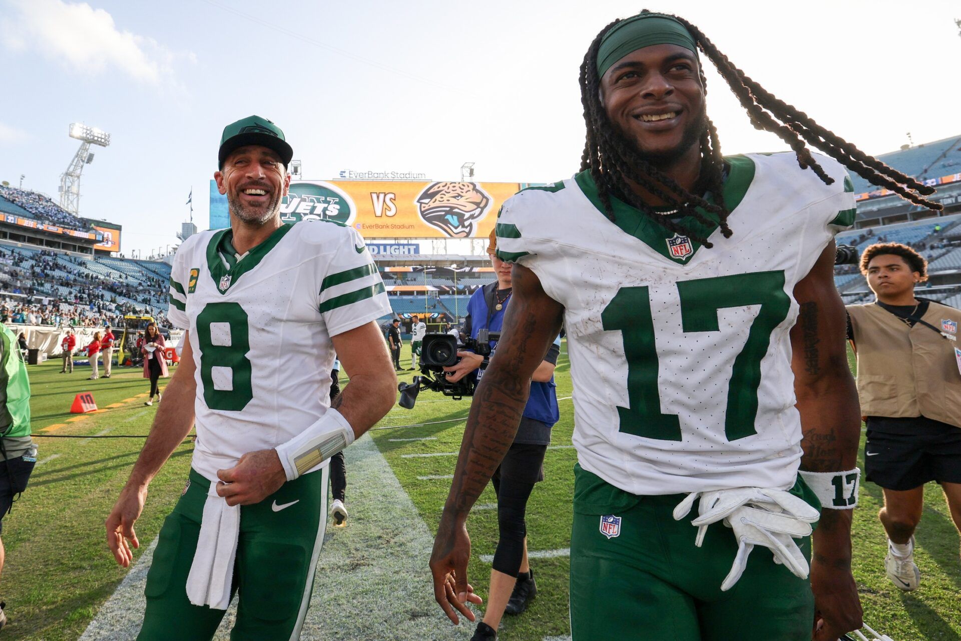 New York Jets quarterback Aaron Rodgers (8) and wide receiver Davante Adams (17) celebrates after beating the Jacksonville Jaguars at EverBank Stadium.