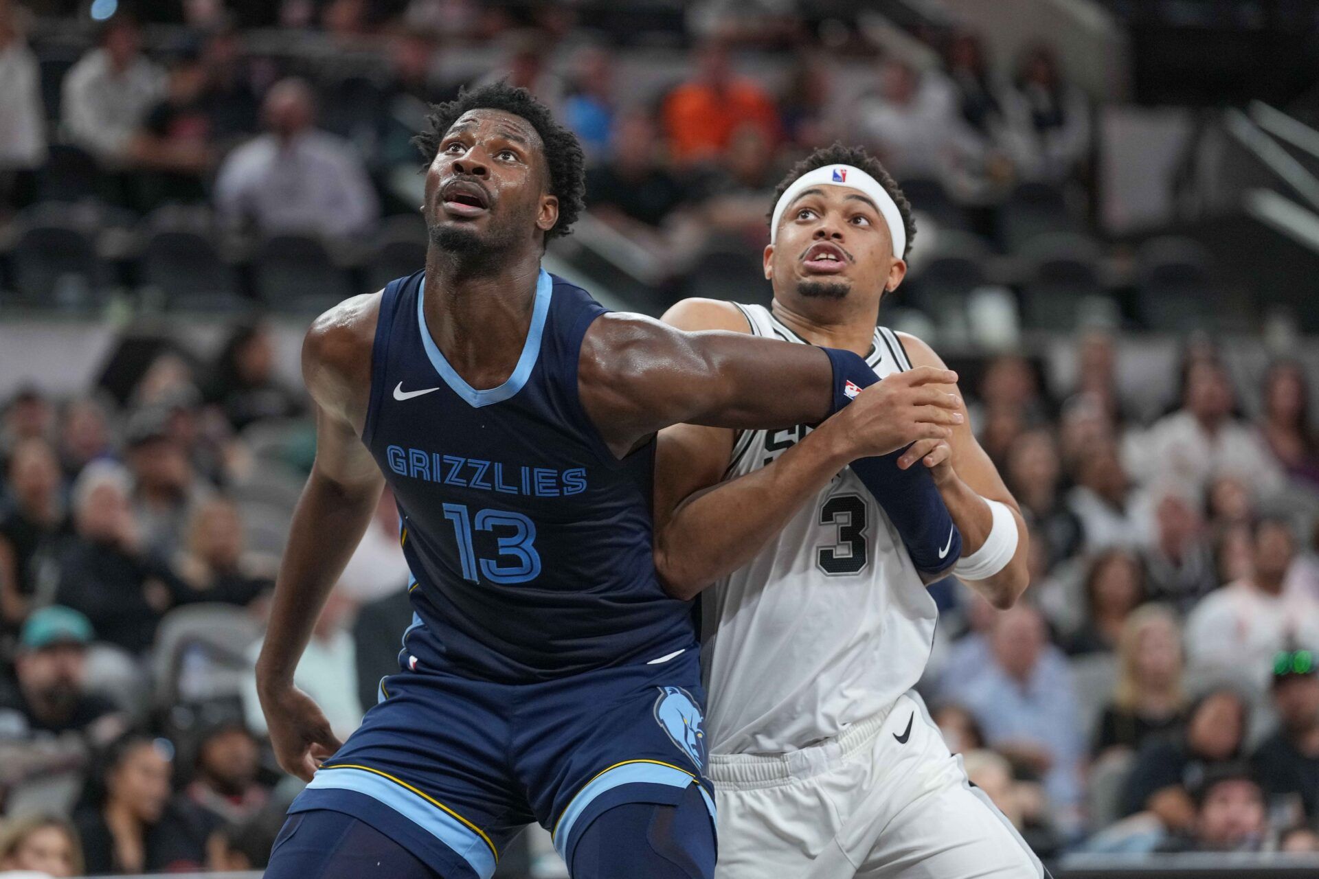 Memphis Grizzlies forward Jaren Jackson Jr. (13) and San Antonio Spurs forward Keldon Johnson (3) battle for position in the second half at Frost Bank Center.