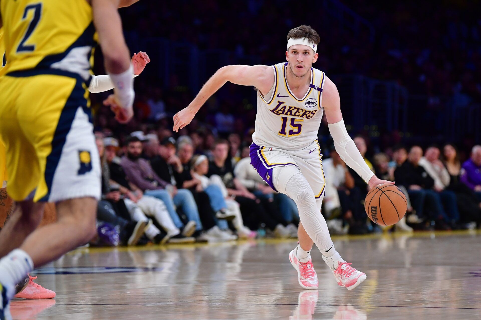 Los Angeles Lakers guard Austin Reaves (15) moves the ball against the Indiana Pacers during the second half at Crypto.com Arena.