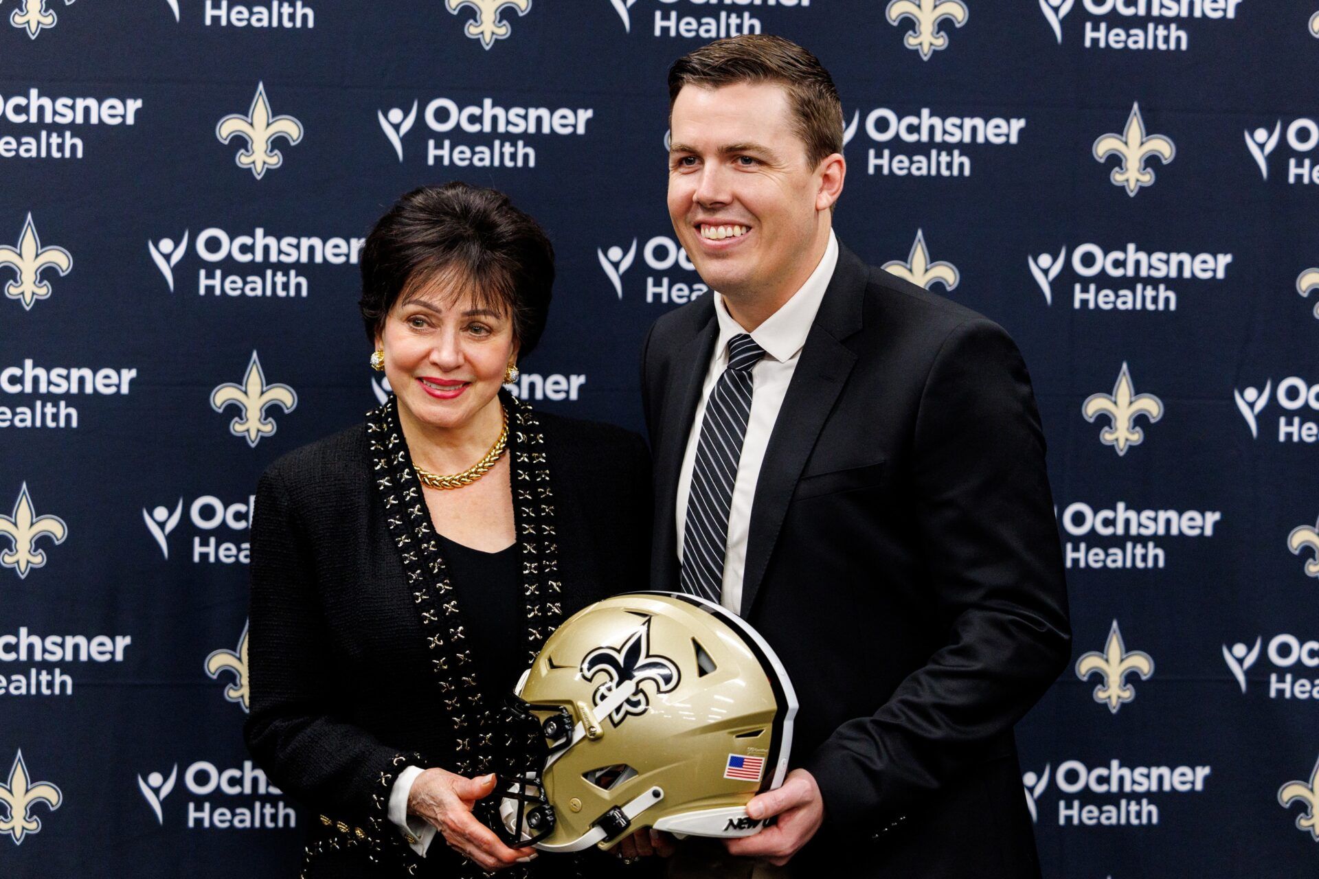 New Orleans Saints owner Gayle Benson poses with the new head coach Kellen Moore at Ochsner Sports Performance Center.