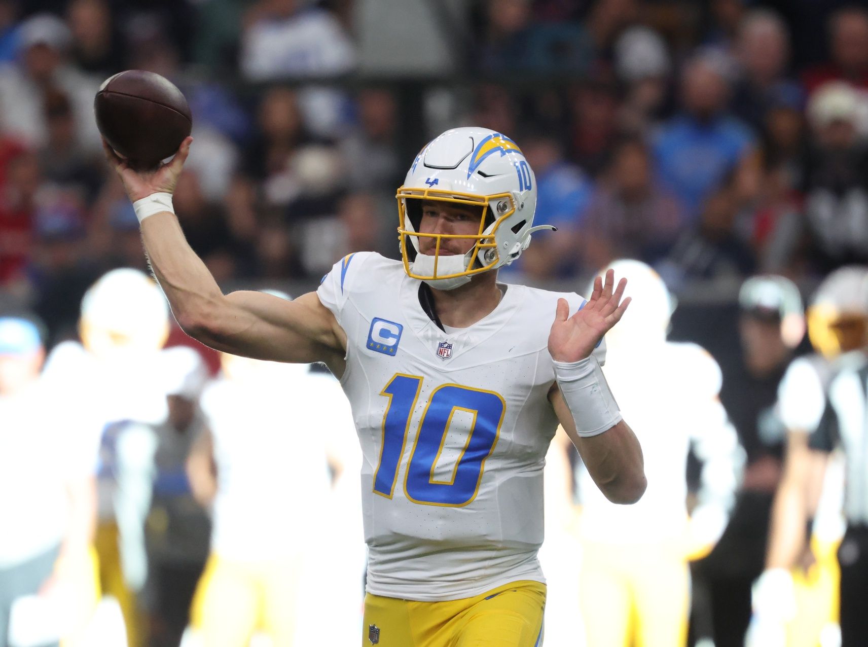 Los Angeles Chargers quarterback Justin Herbert (10) passes the ball during the first quarter against the Houston Texans in an AFC wild card game at NRG Stadium.