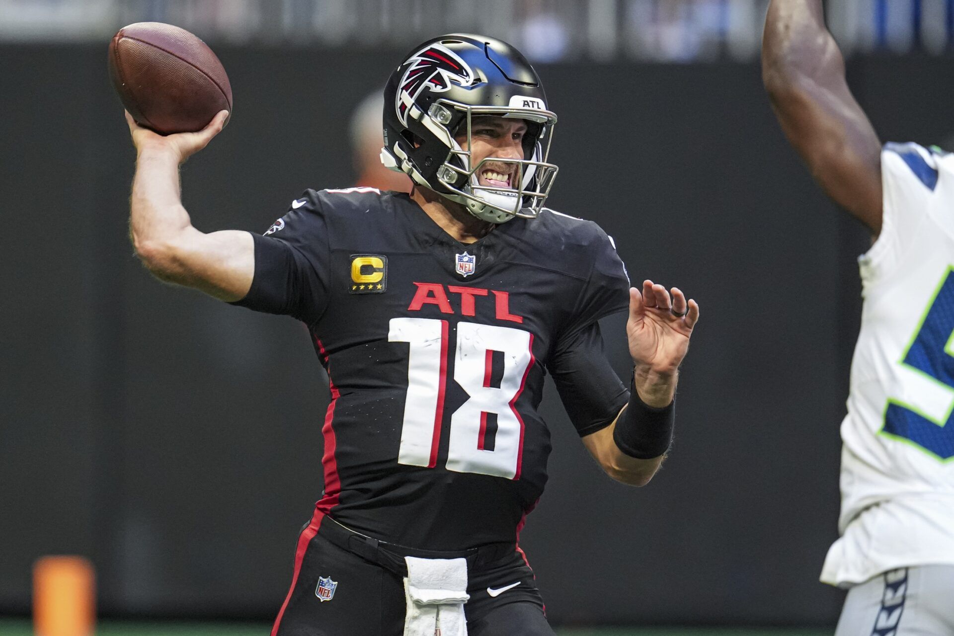 Atlanta Falcons quarterback Kirk Cousins (18) passes the ball against the Seattle Seahawks at Mercedes-Benz Stadium.