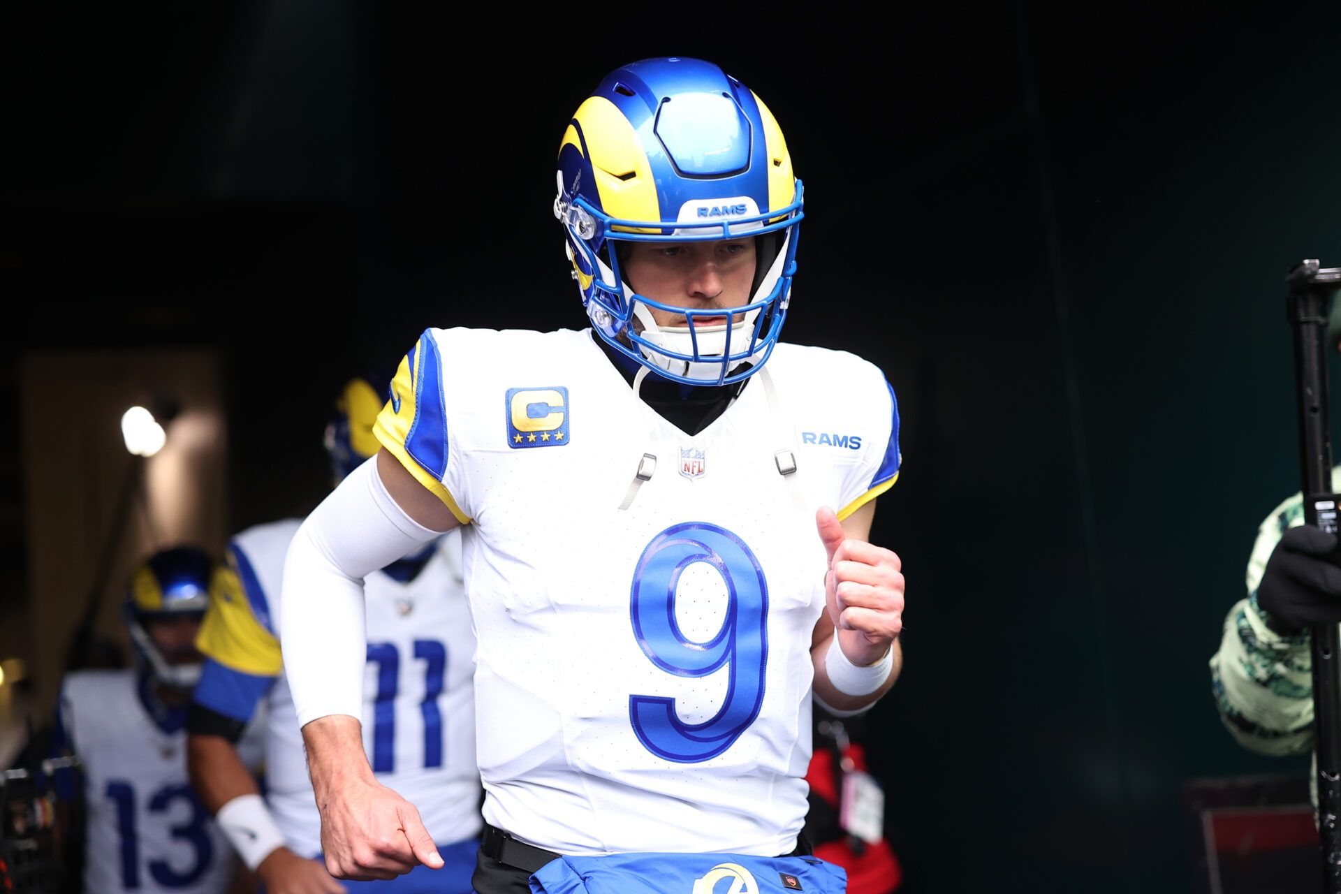 Jan 19, 2025; Philadelphia, Pennsylvania, USA; Los Angeles Rams quarterback Matthew Stafford (9) runs onto the field prior to the game against the Philadelphia Eagles in a 2025 NFC divisional round game at Lincoln Financial Field. Mandatory Credit: Bill Streicher-Imagn Images