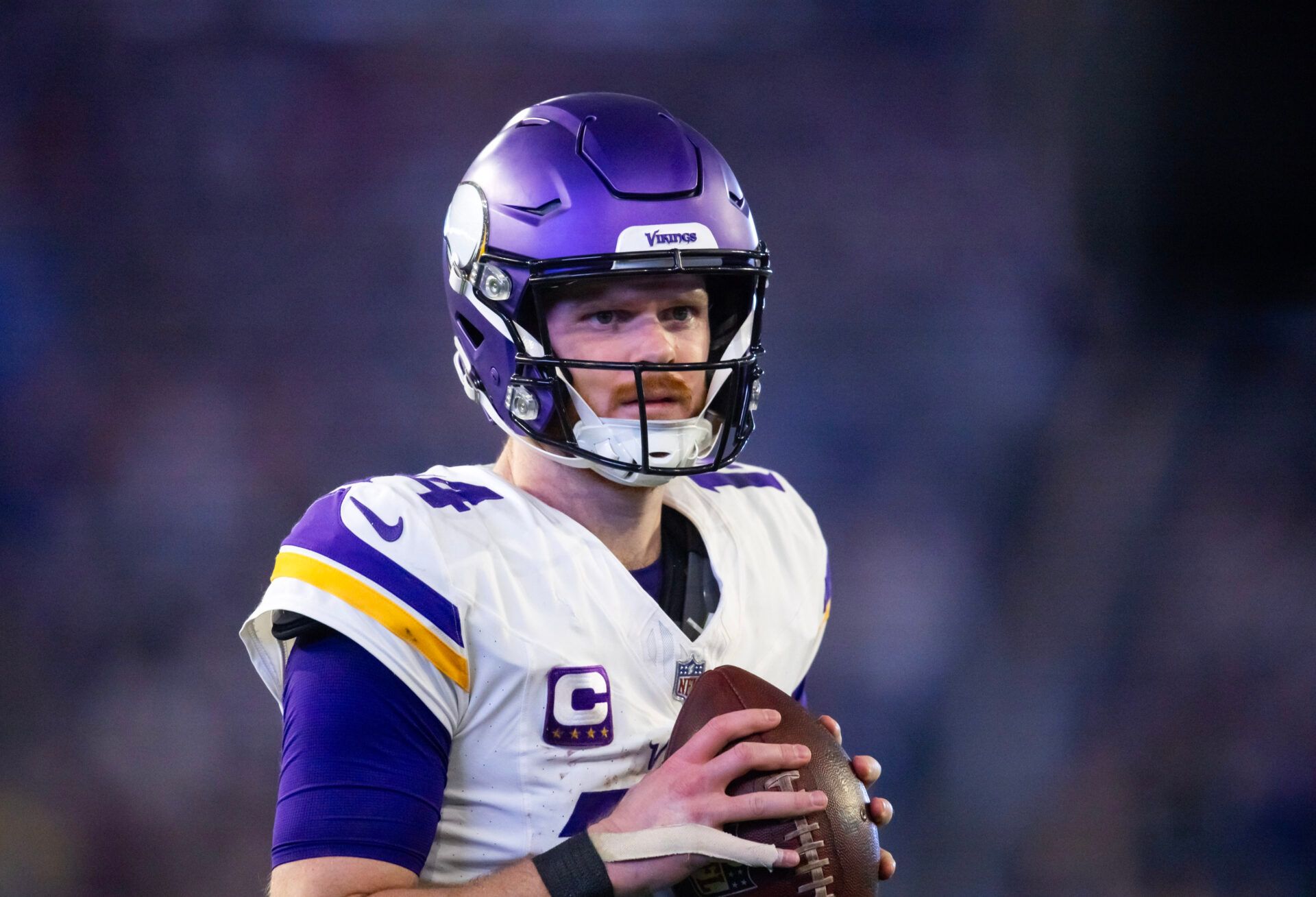 Jan 13, 2025; Glendale, AZ, USA; Minnesota Vikings quarterback Sam Darnold (14) against the Los Angeles Rams during an NFC wild card game at State Farm Stadium. Mandatory Credit: Mark J. Rebilas-Imagn Images