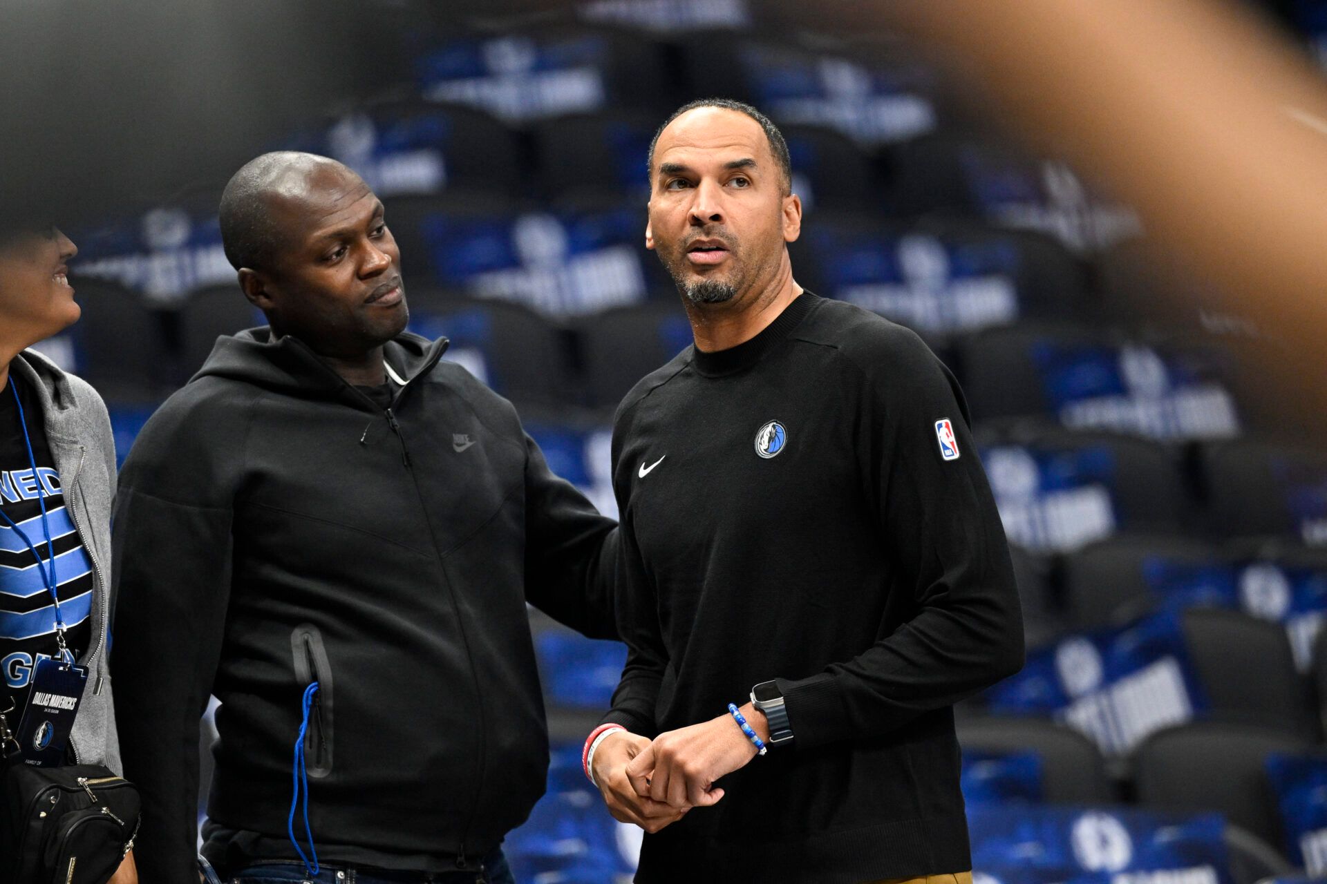 Oct 7, 2024; Dallas, Texas, USA; Dallas Mavericks general manager Nico Harrison (right) looks on during warms up before the game between the Dallas Mavericks and the Memphis Grizzlies at the American Airlines Center. Mandatory Credit: Jerome Miron-Imagn Images