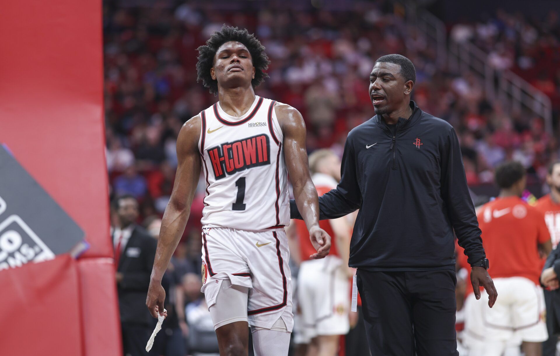 Houston Rockets forward Amen Thompson (1) walks off the court after being ejected during the fourth quarter against the Milwaukee Bucks at Toyota Center.