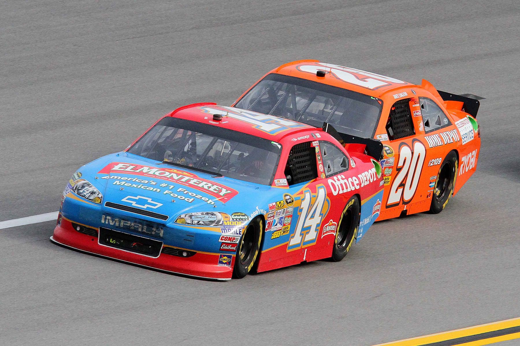 NASCAR Sprint Cup Series driver Tony Stewart (14) and Joey Logano (20) during the Good Sam Club 500 at Talladega Superspeedway.