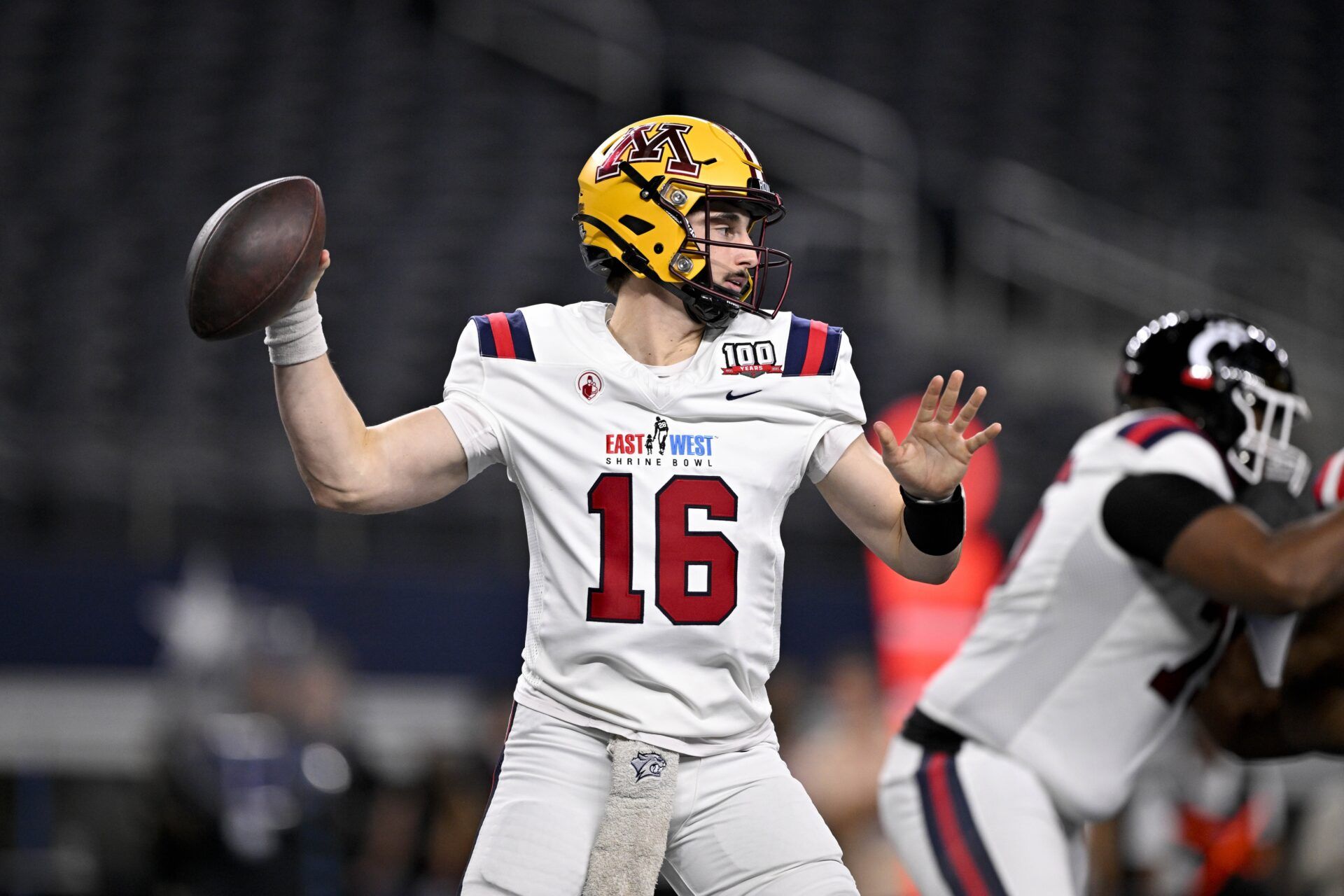 West quarterback Max Brosmer of Minnesota (16) passes the ball against the East during the second half at AT&T Stadium.