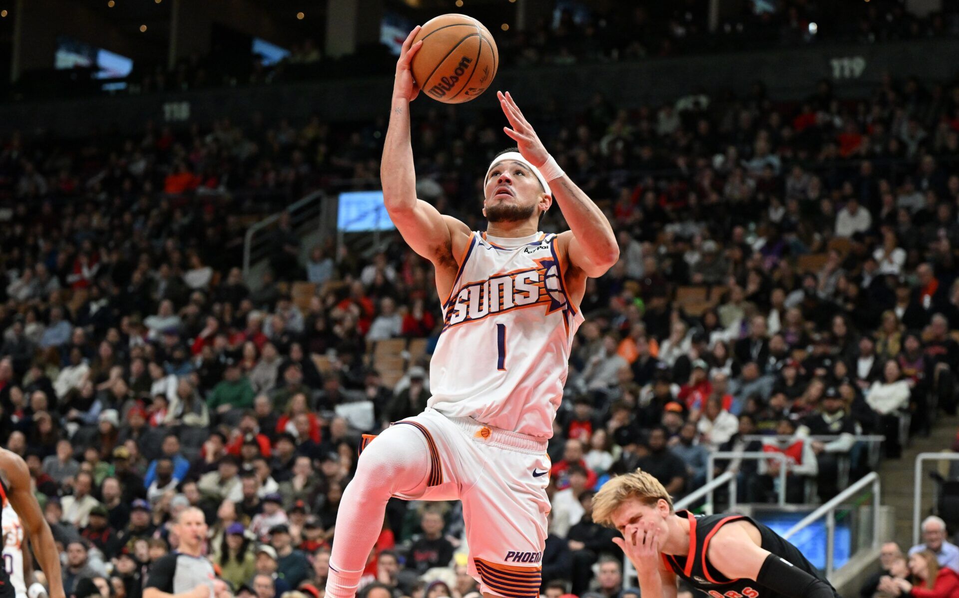 Phoenix Suns guard Devin Booker (1) goes up for a layup basket against the Toronto Raptors in the second half at Scotiabank Arena.