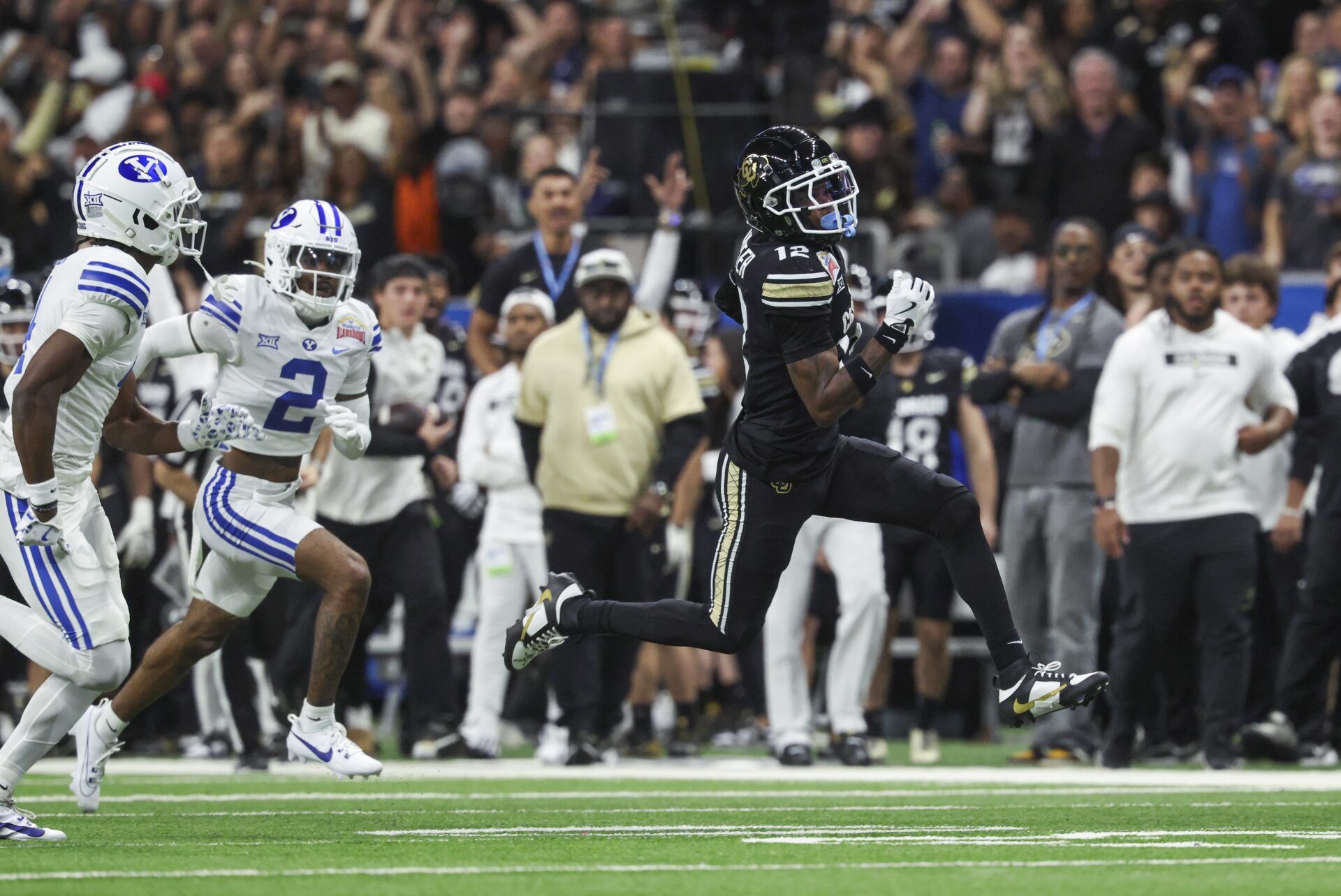 Colorado Buffaloes wide receiver Travis Hunter (12) runs with the ball during the second quarter against the Brigham Young Cougars at Alamodome.