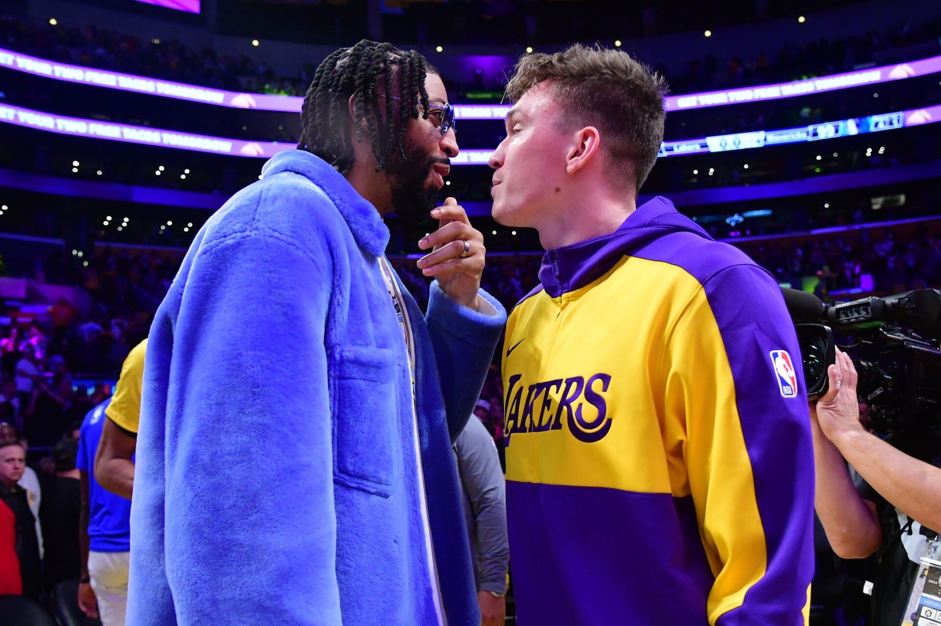 Dallas Mavericks forward Anthony Davis (left) reacts with Los Angeles Lakers guard Dalton Knecht (right) after the game at Crypto.com Arena.