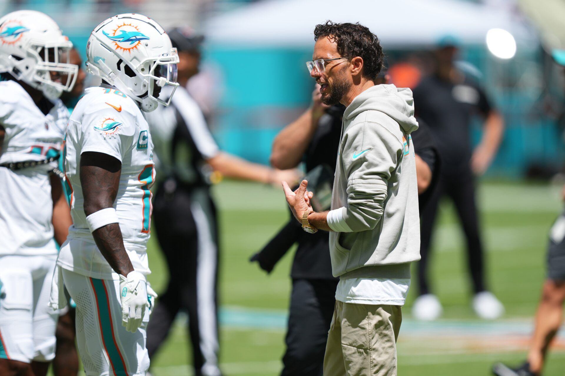 Miami Dolphins head coach Mike McDaniel talks with Miami Dolphins wide receiver Tyreek Hill (10) during pregame warm-ups at Hard Rock Stadium.