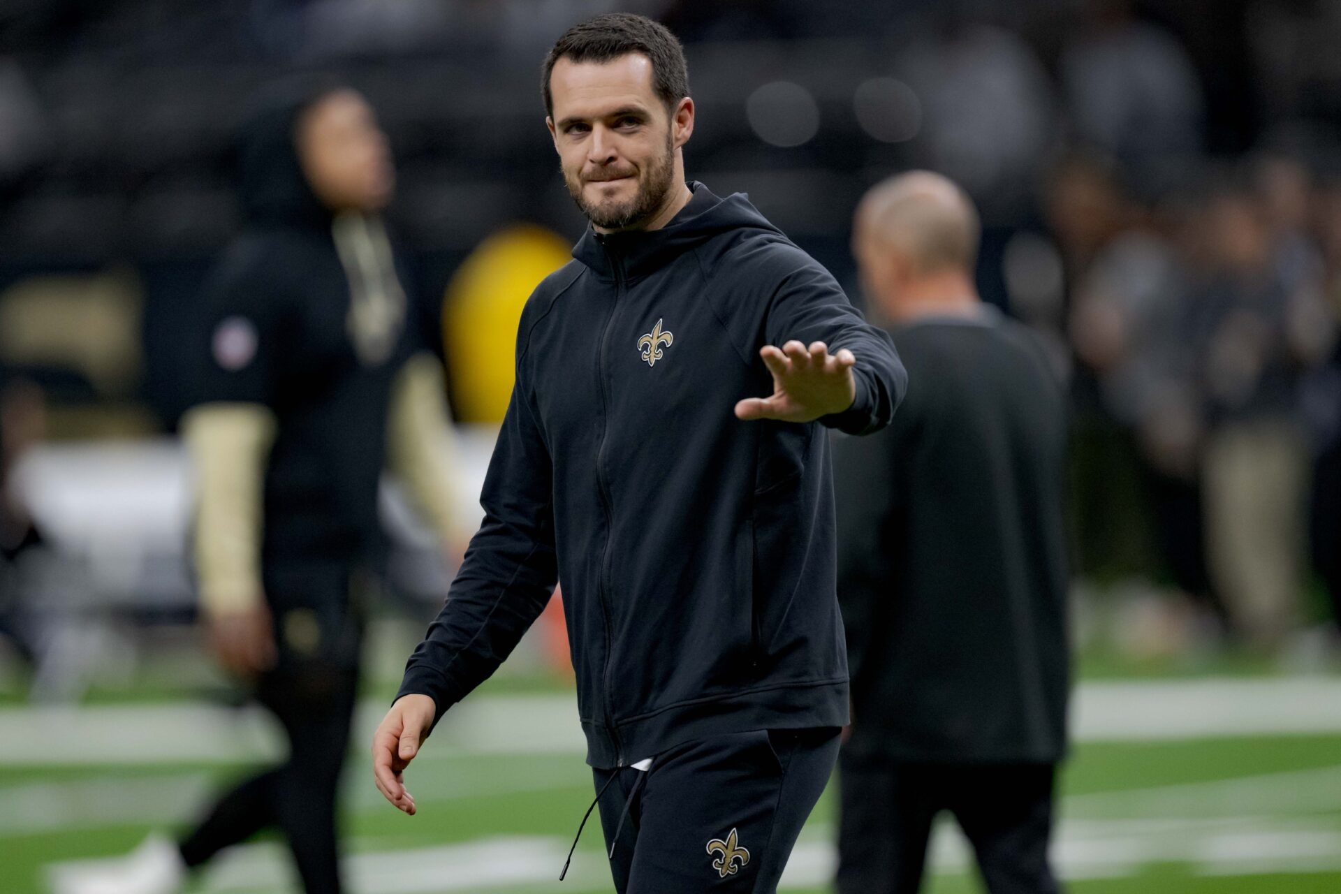 New Orleans Saints quarterback Derek Carr (4) walks the field before a game against the Las Vegas Raiders at Caesars Superdome.