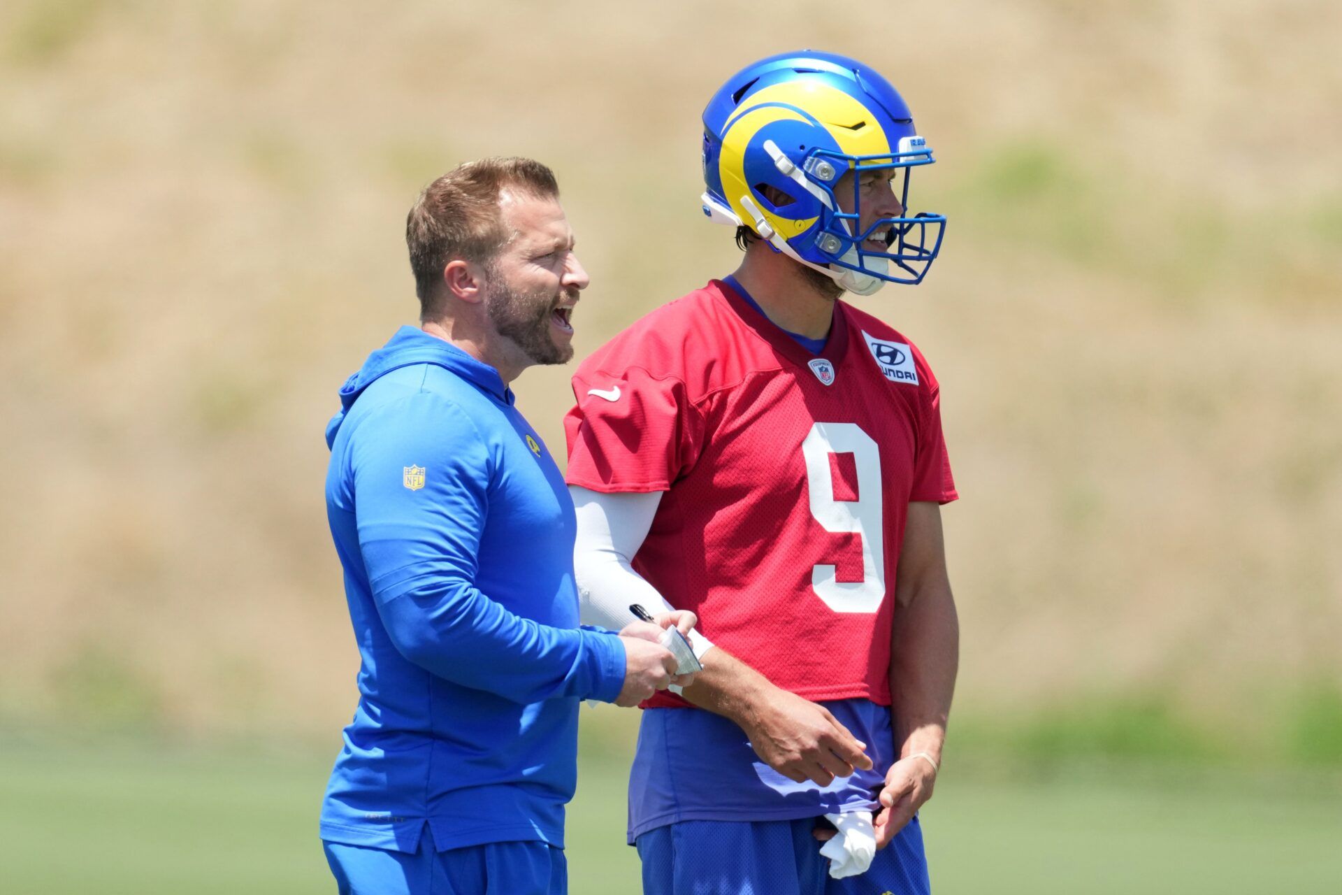 Los Angeles Rams coach Sean McVay (left) talks with quarterback Matthew Stafford (9) during organized team activities at Cal Lutheran University.