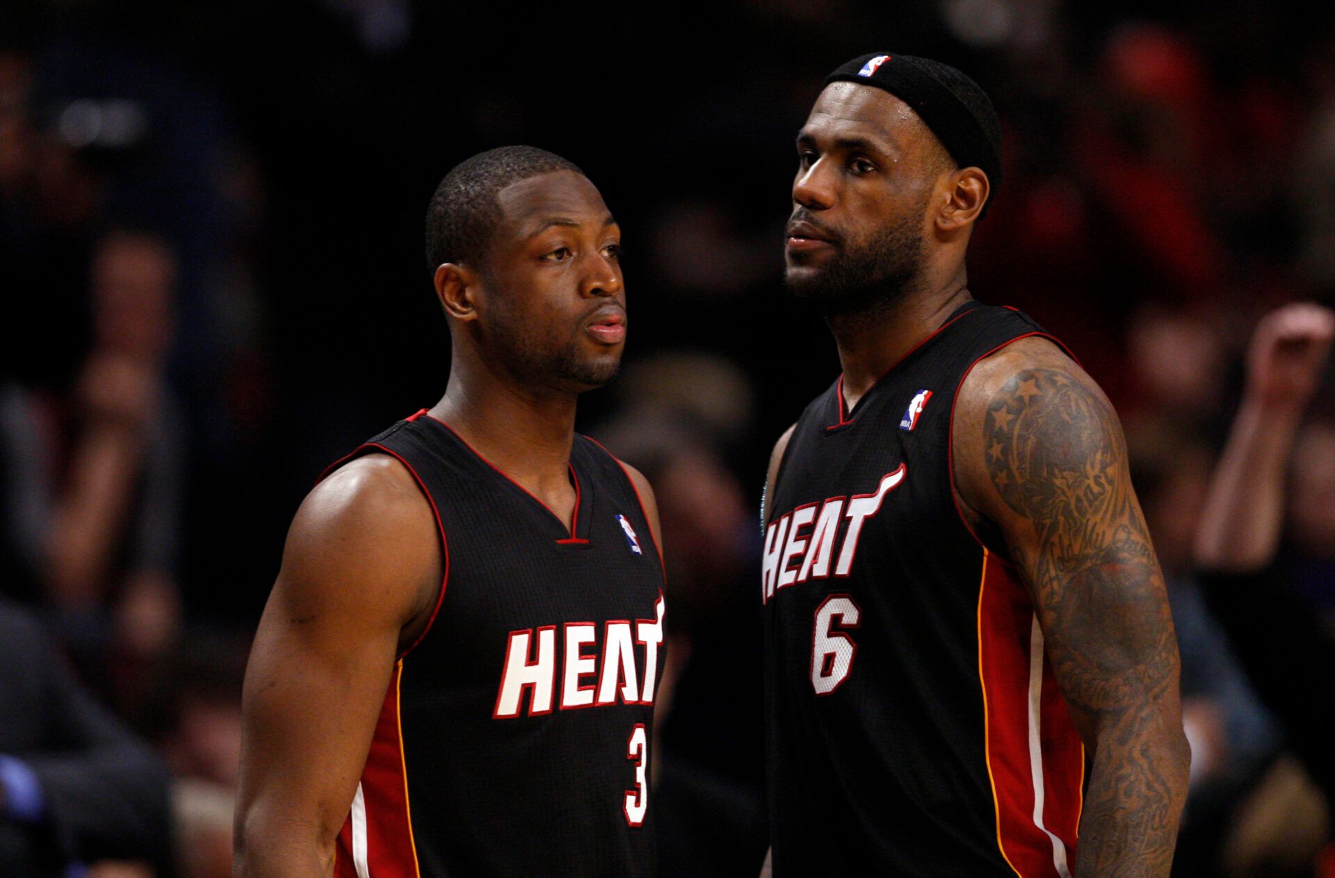 Feb 24, 2011; Chicago, IL, USA; Miami Heat shooting guard Dwyane Wade (3) talks with LeBron James (6) during the second half against the Chicago Bulls at the United Center. The Bulls won 93-89. Mandatory Credit: Jerry Lai-USA TODAY Sports