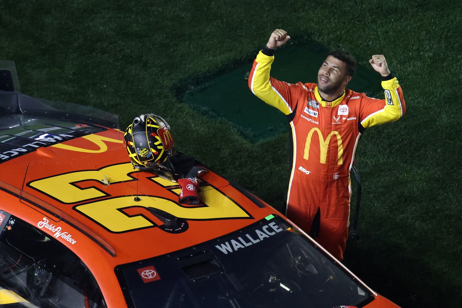 NASCAR Cup Series driver Bubba Wallace (23) reacts after winning Duel 1 at Daytona International Speedway.