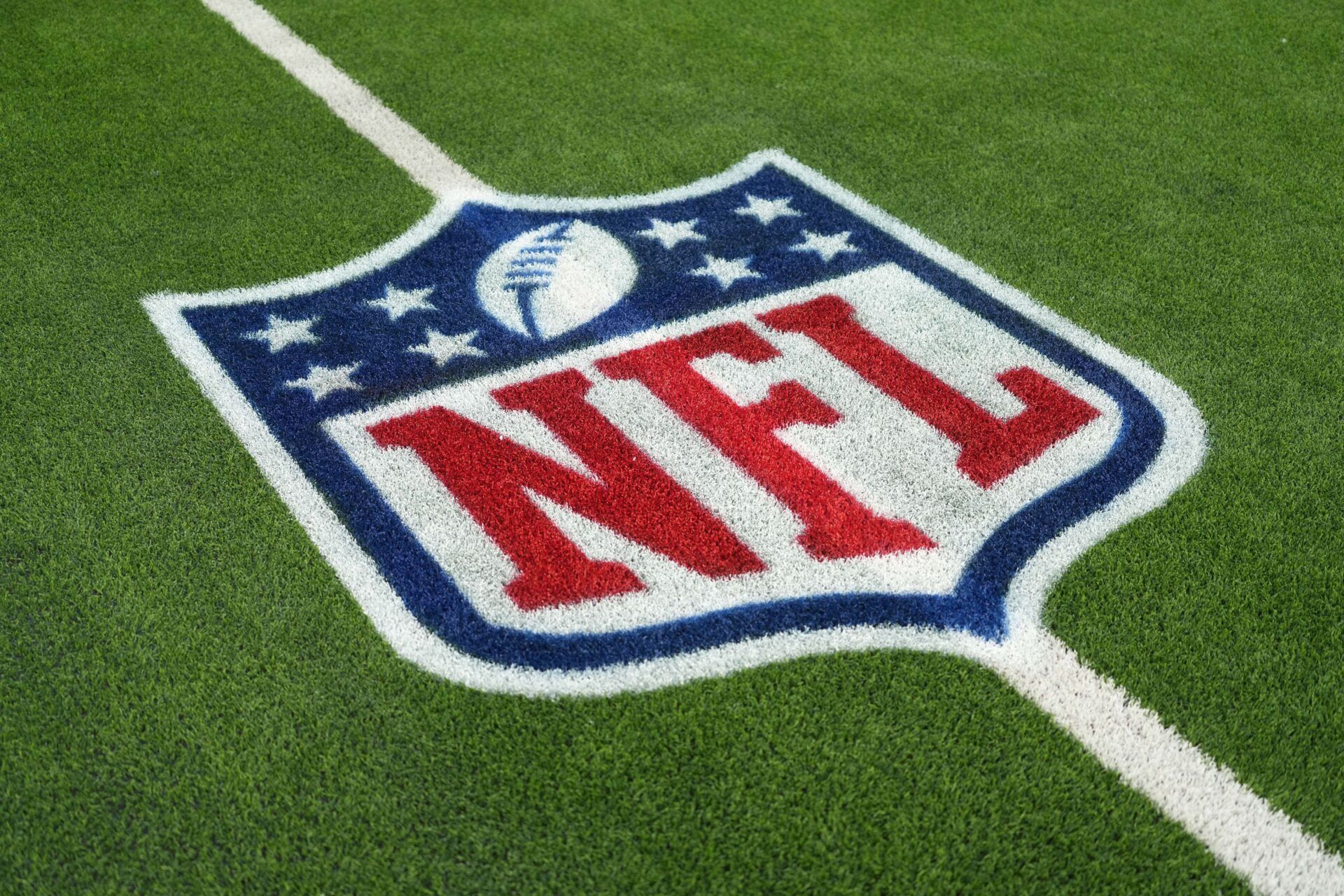 The NFL shield logo is seen on the field at SoFi Stadium before a game between the Arizona Cardinals and Los Angeles Rams.