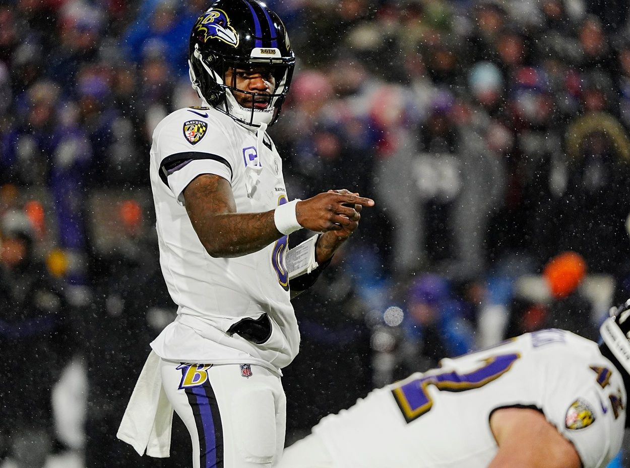 Baltimore Ravens quarterback Lamar Jackson directs his teammates before the snap.