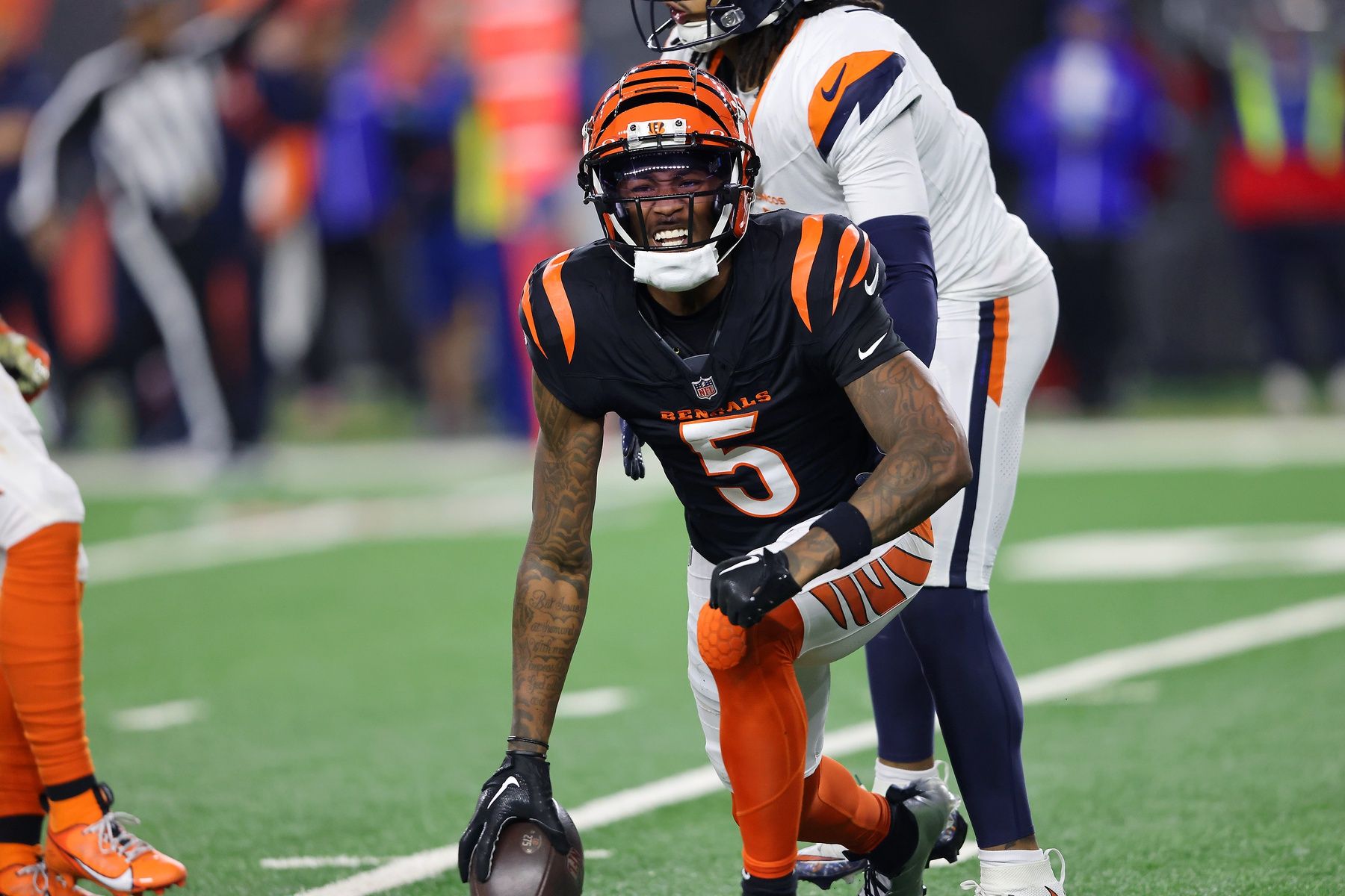 Cincinnati Bengals wide receiver Tee Higgins (5) reacts after catching a first down pass in overtime against the Denver Broncos at Paycor Stadium.