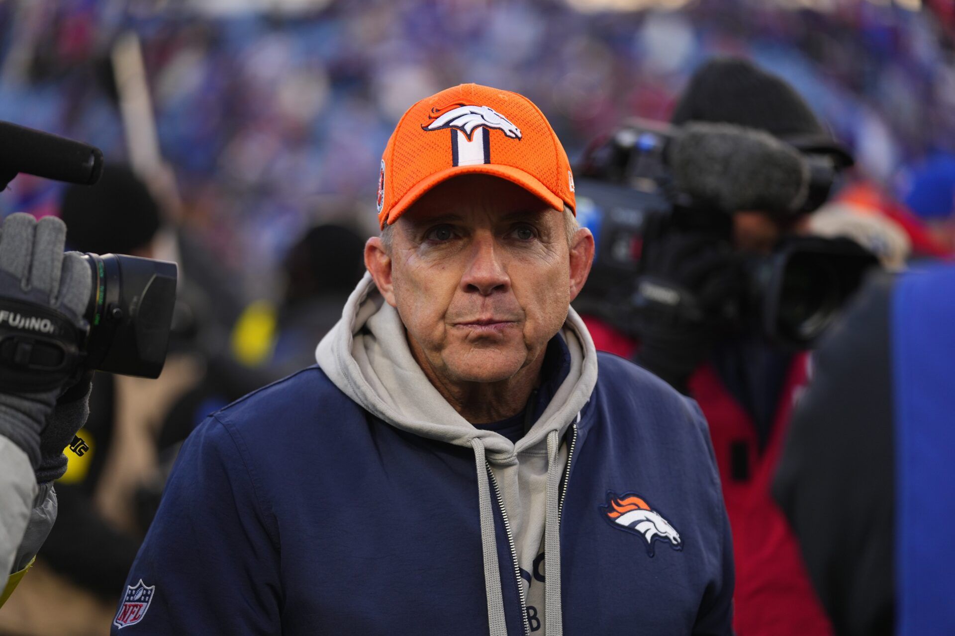 Denver Broncos head coach Sean Payton walks off the field after losing to the Buffalo Bills in an AFC wild card game at Highmark Stadium.