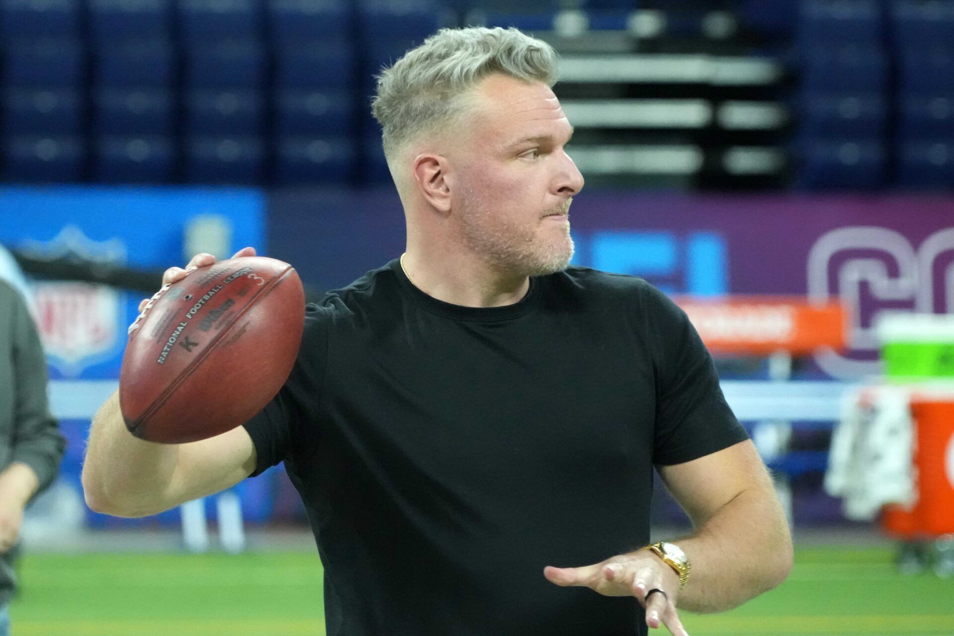 Feb 27, 2025; Indianapolis, IN, USA; Pat McAfee throws the ball during workouts at the 2025 NFL Scouting Combine at Lucas Oil Stadium. Mandatory Credit: Kirby Lee-Imagn Images