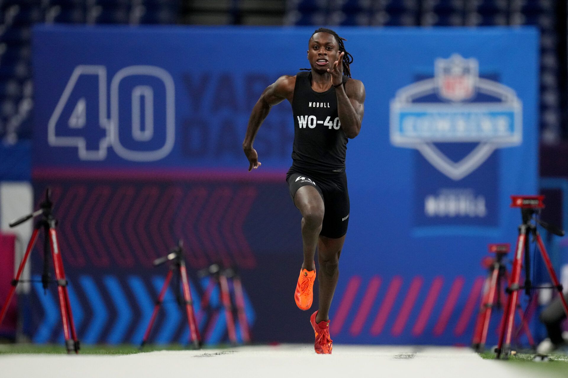 Mar 2, 2024; Indianapolis, IN, USA; Texas wide receiver Xavier Worthy (WO40) ran an official time of 4.21 seconds to set a combine record during the 2024 NFL Combine at Lucas Oil Stadium. Mandatory Credit: Kirby Lee-USA TODAY Sports