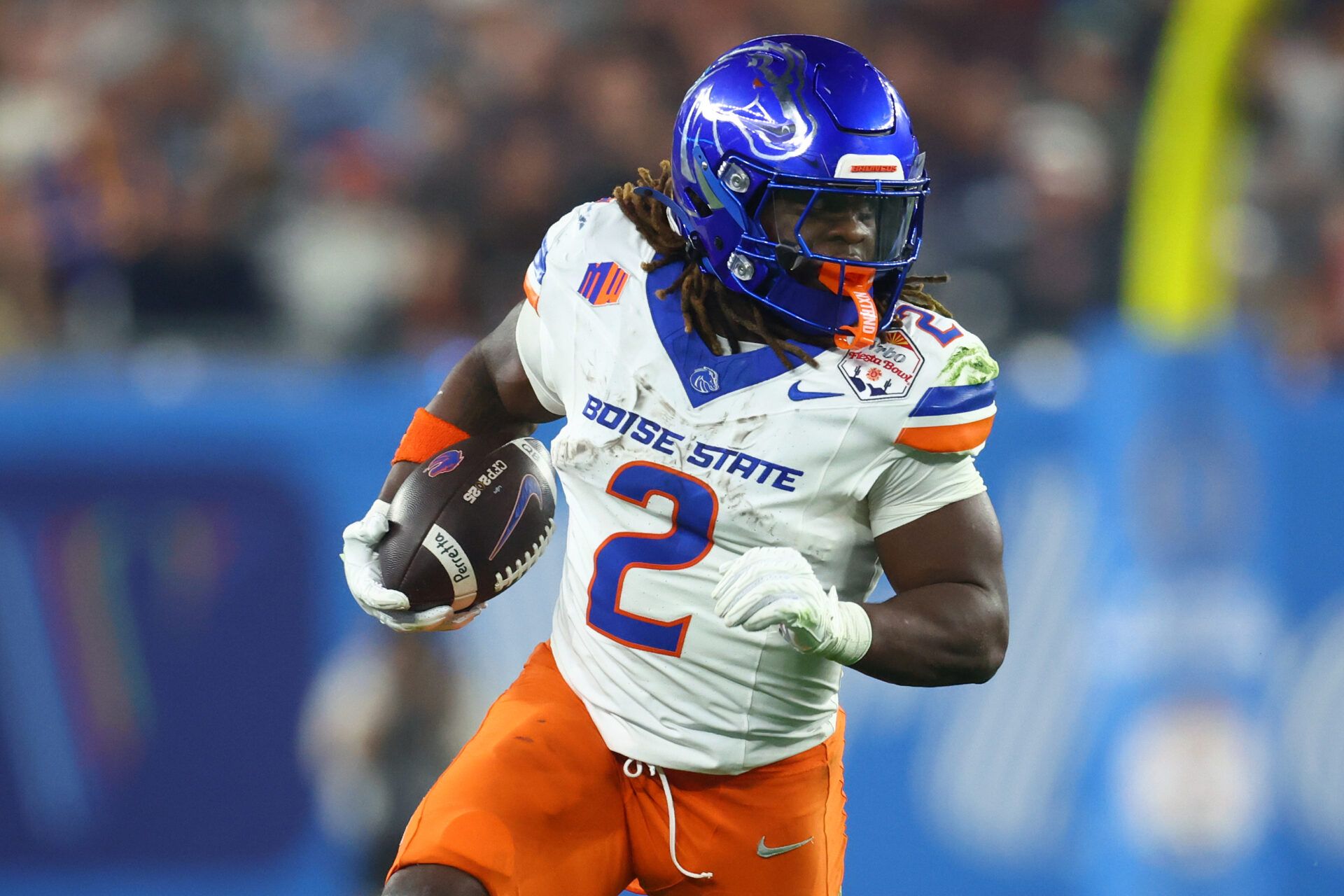 Dec 31, 2024; Glendale, AZ, USA; Boise State Broncos running back Ashton Jeanty (2) rushes the ball against the Penn State Nittany Lions during the first half in the Fiesta Bowl at State Farm Stadium. Mandatory Credit: Mark J. Rebilas-Imagn Images