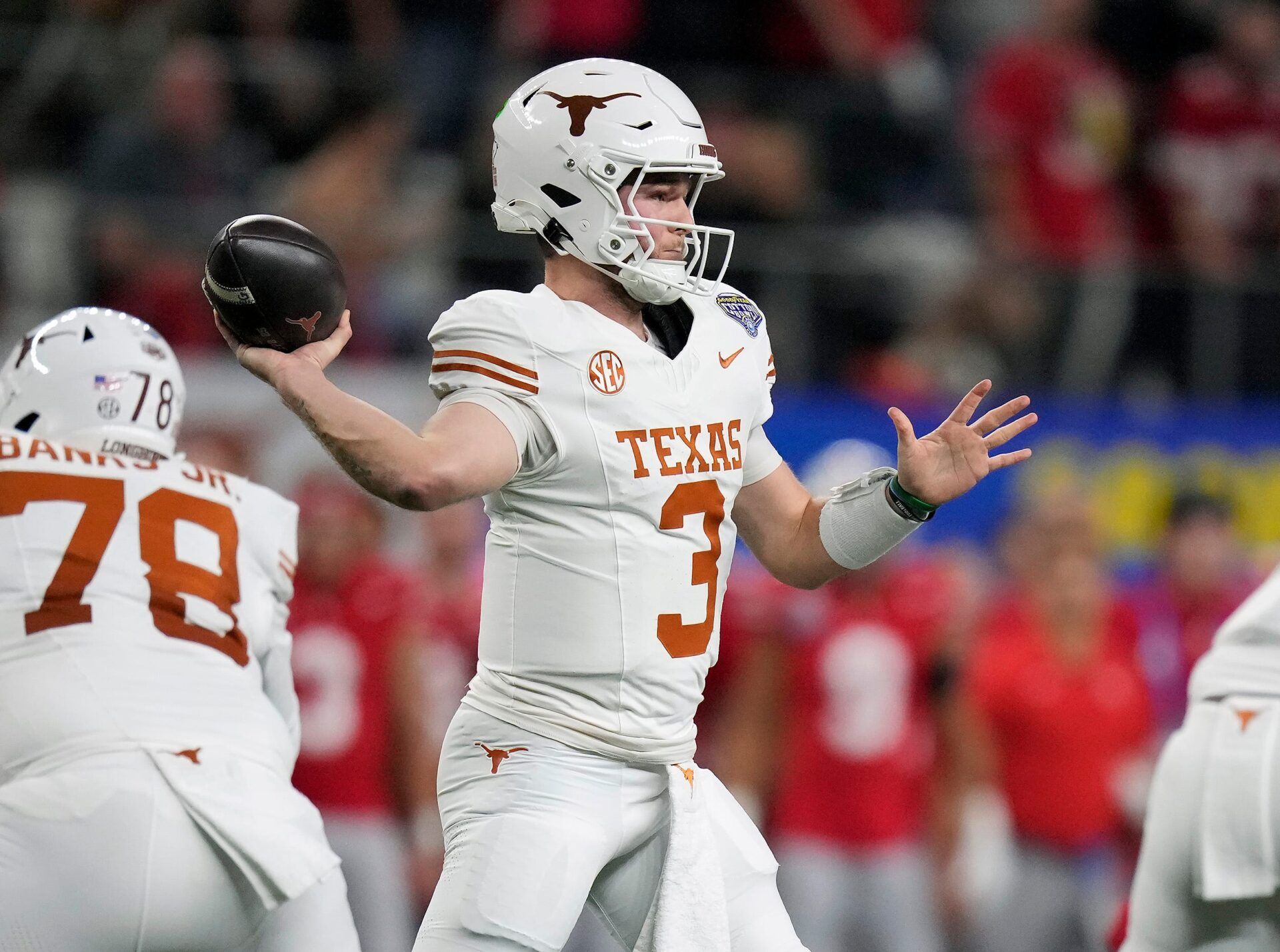 Texas Longhorns quarterback Quinn Ewers (3) throws the ball against Ohio State Buckeyes defense in the first quarter of the Cotton Bowl Classic during the College Football Playoff semifinal game at AT&T Stadium in Arlington, Texas on January, 10, 2025.