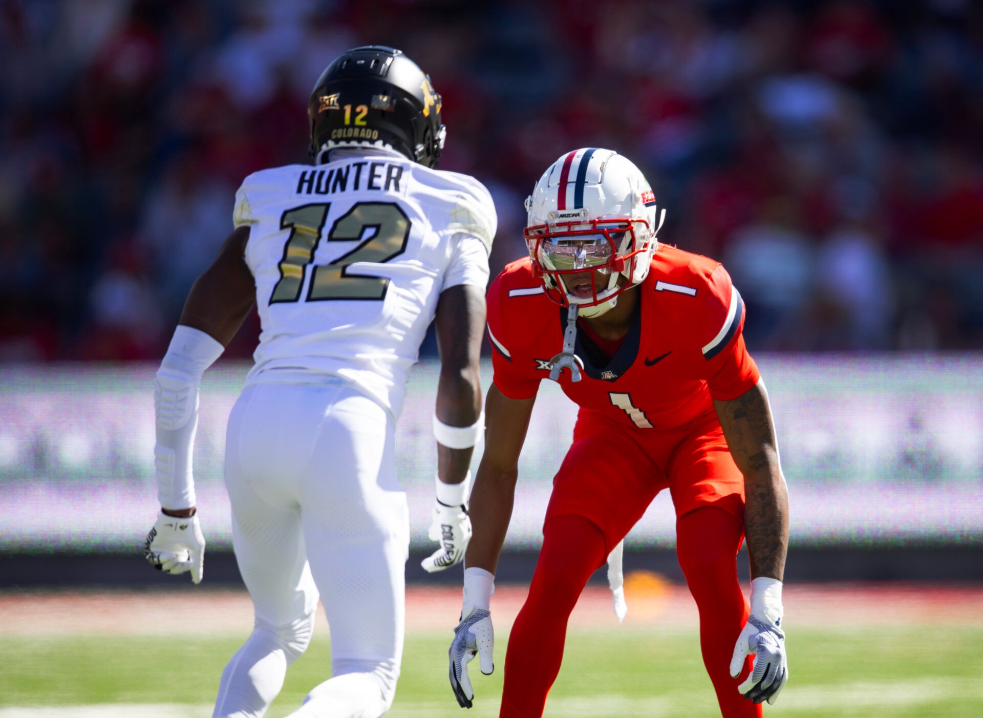 Oct 19, 2024; Tucson, Arizona, USA; Colorado Buffalos wide receiver Travis Hunter (12) against Arizona Wildcats cornerback Tacario Davis (1) at Arizona Stadium. Mandatory Credit: Mark J. Rebilas-Imagn Images