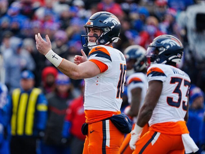 Denver Broncos quarterback Bo Nix (10) signals to the players before the snap during the first half of the Buffalo Bills wild card game against the Denver Broncos at Highmark Stadium in Orchard Park on Jan. 12, 2025.