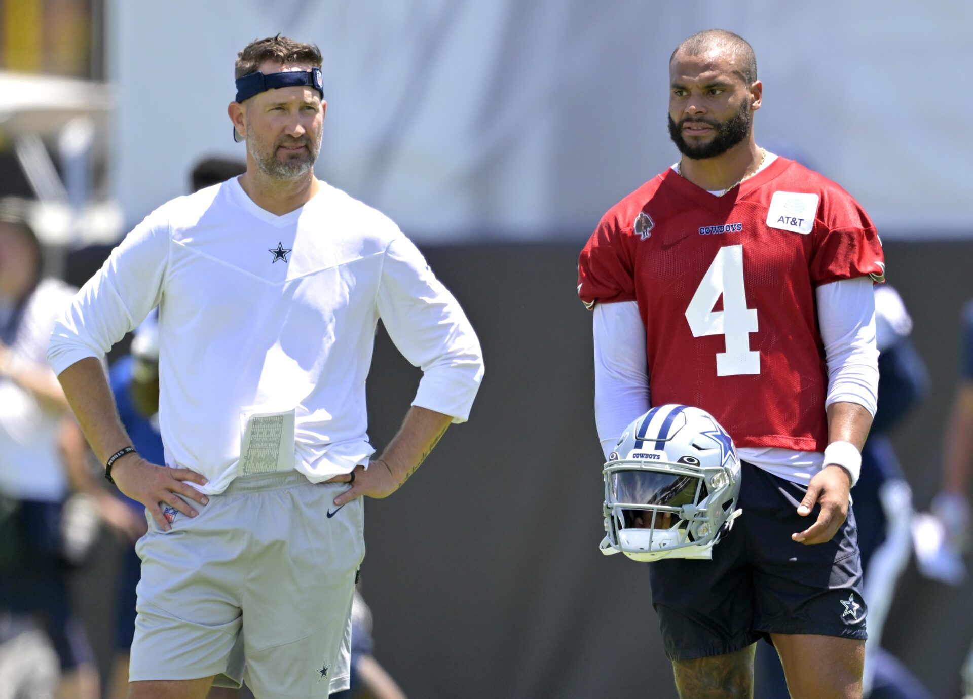 Dallas Cowboys quarterback Dak Prescott (4) talks with offensive coordinator Brian Schottenheimer during training camp at River Ridge Playing Fields in Oxnard, CA.