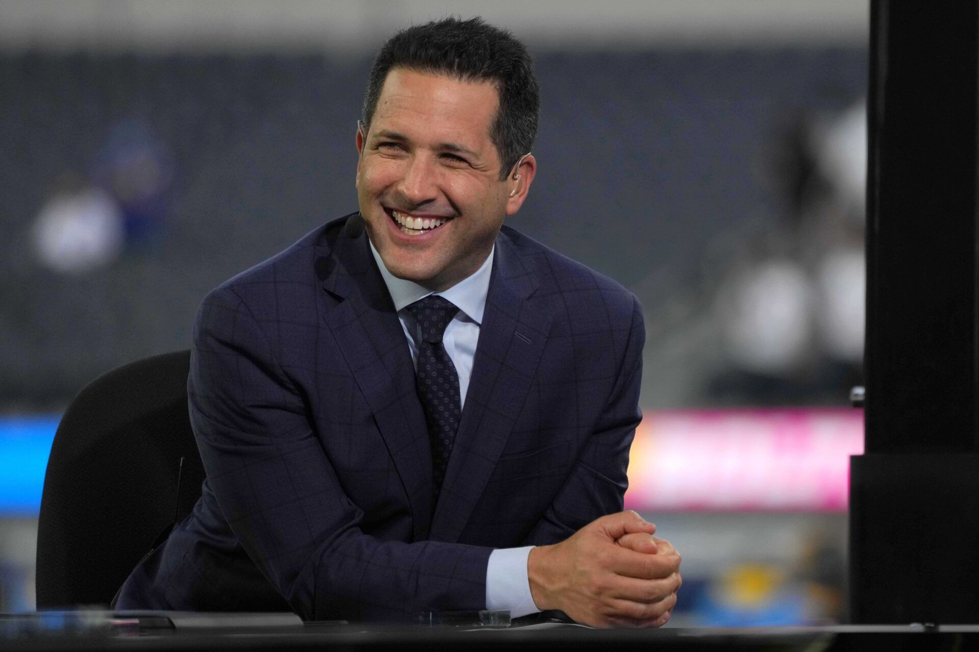 Adam Schefter broadcasts from the ESPN Monday Night Football Countdown set before a game between the Los Angeles Chargers and the Las Vegas Raiders at SoFi Stadium.