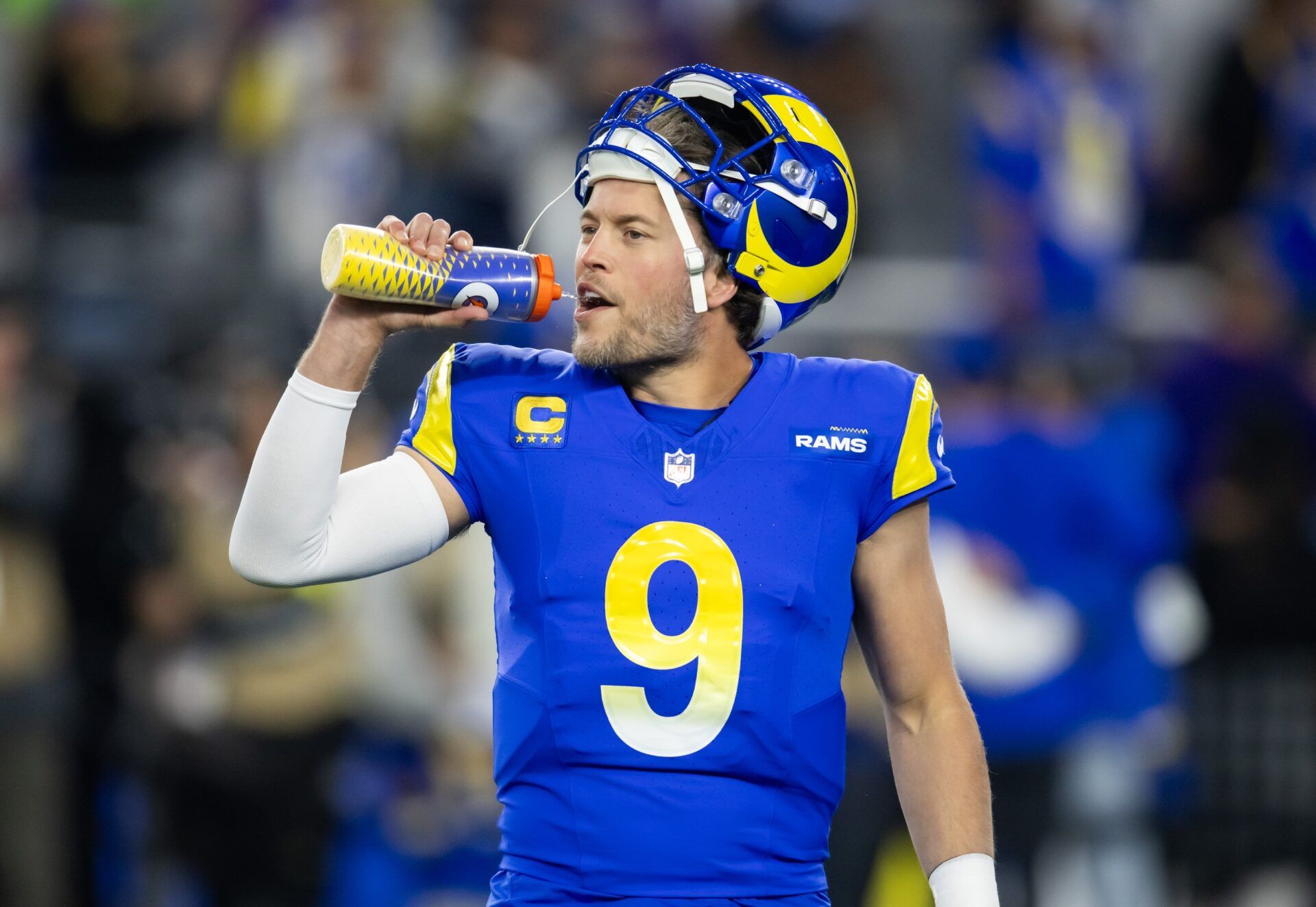 Los Angeles Rams quarterback Matthew Stafford (9) drinks from a gatorade bottle against the Minnesota Vikings during an NFC wild card game at State Farm Stadium.